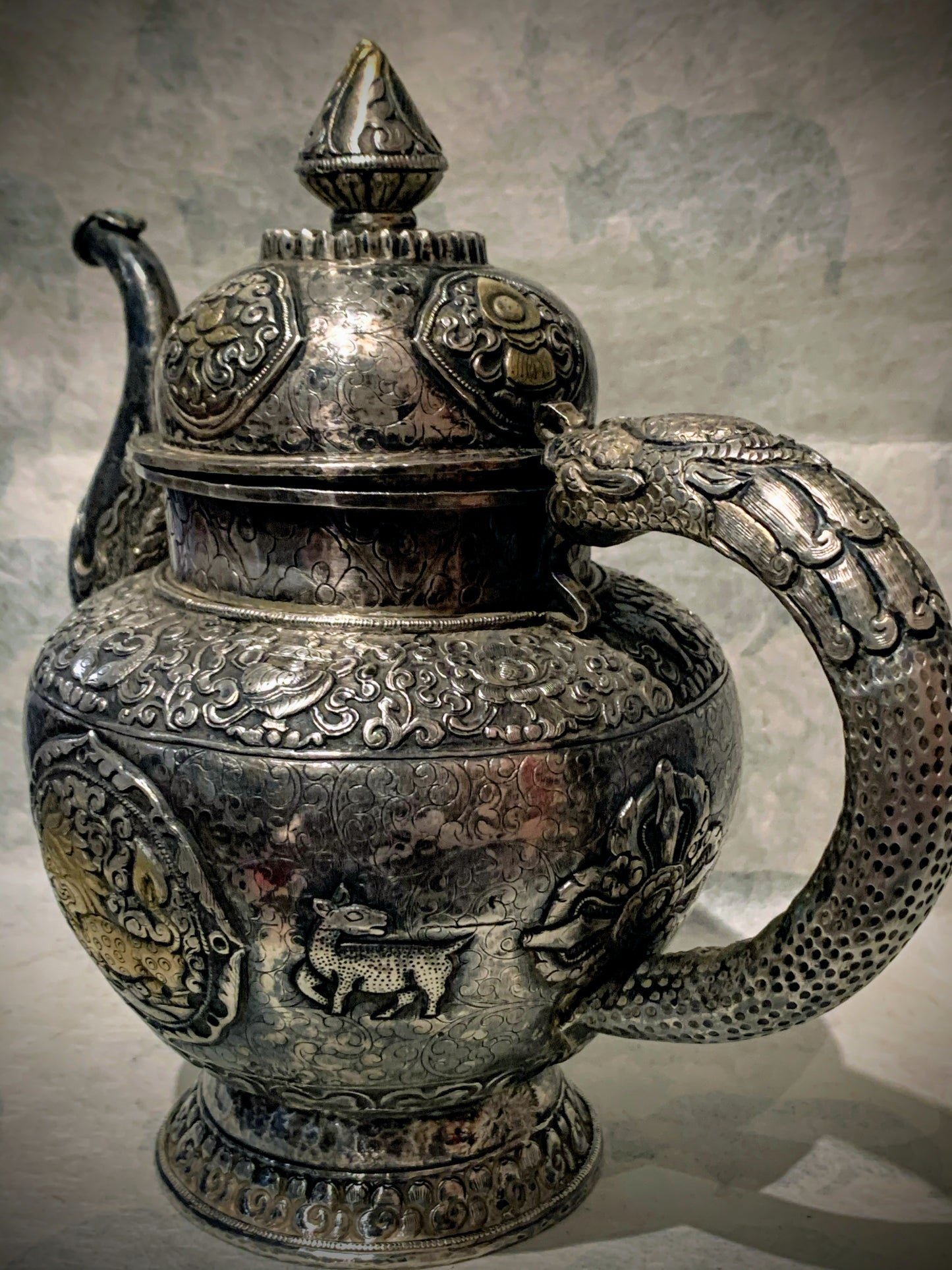 An antique silver and gilt ceremonial Tibetan teapot