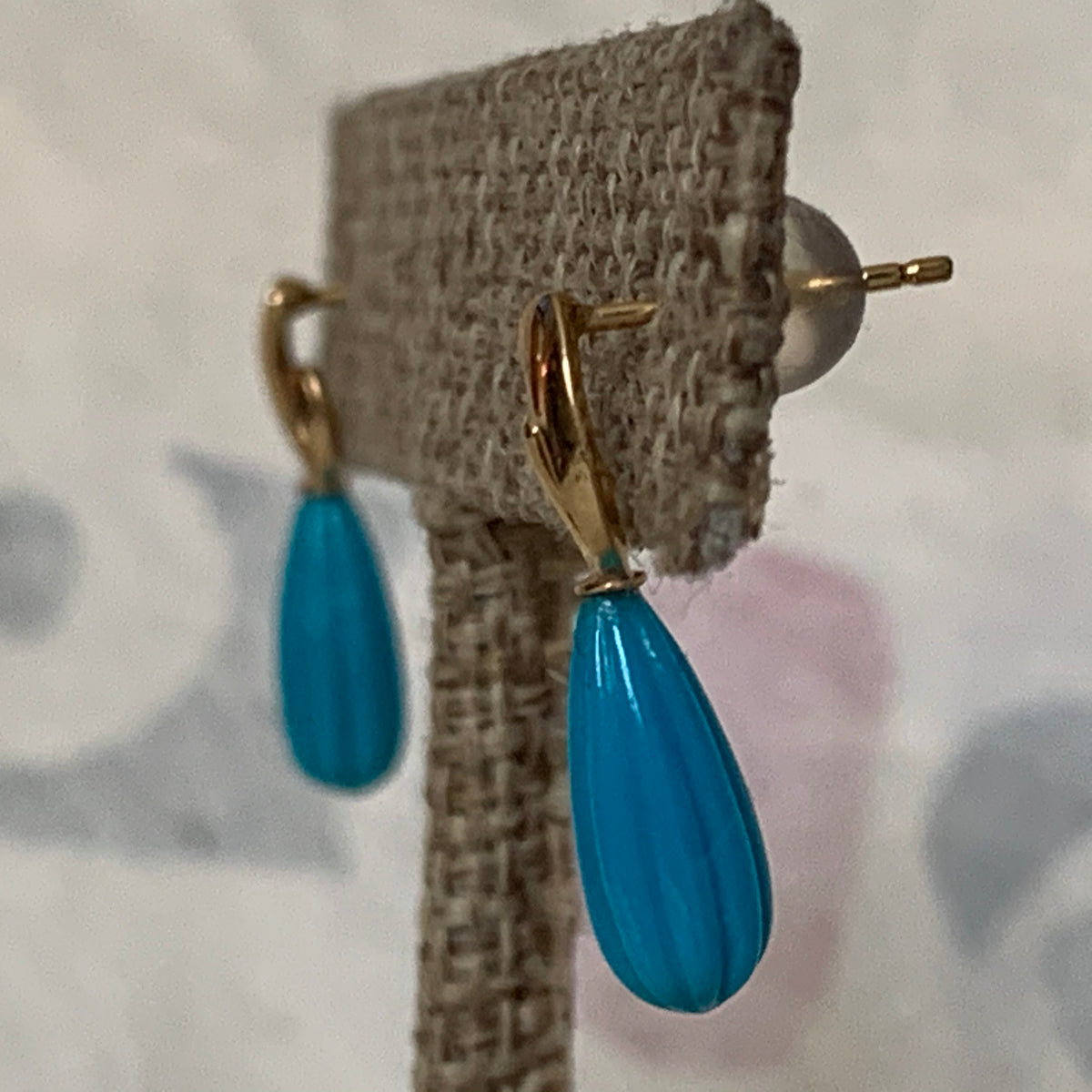 A pair of turquoise earrings