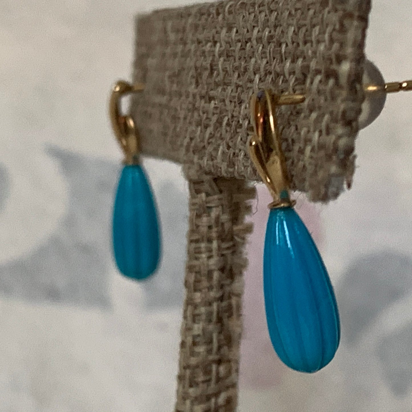 A pair of turquoise earrings