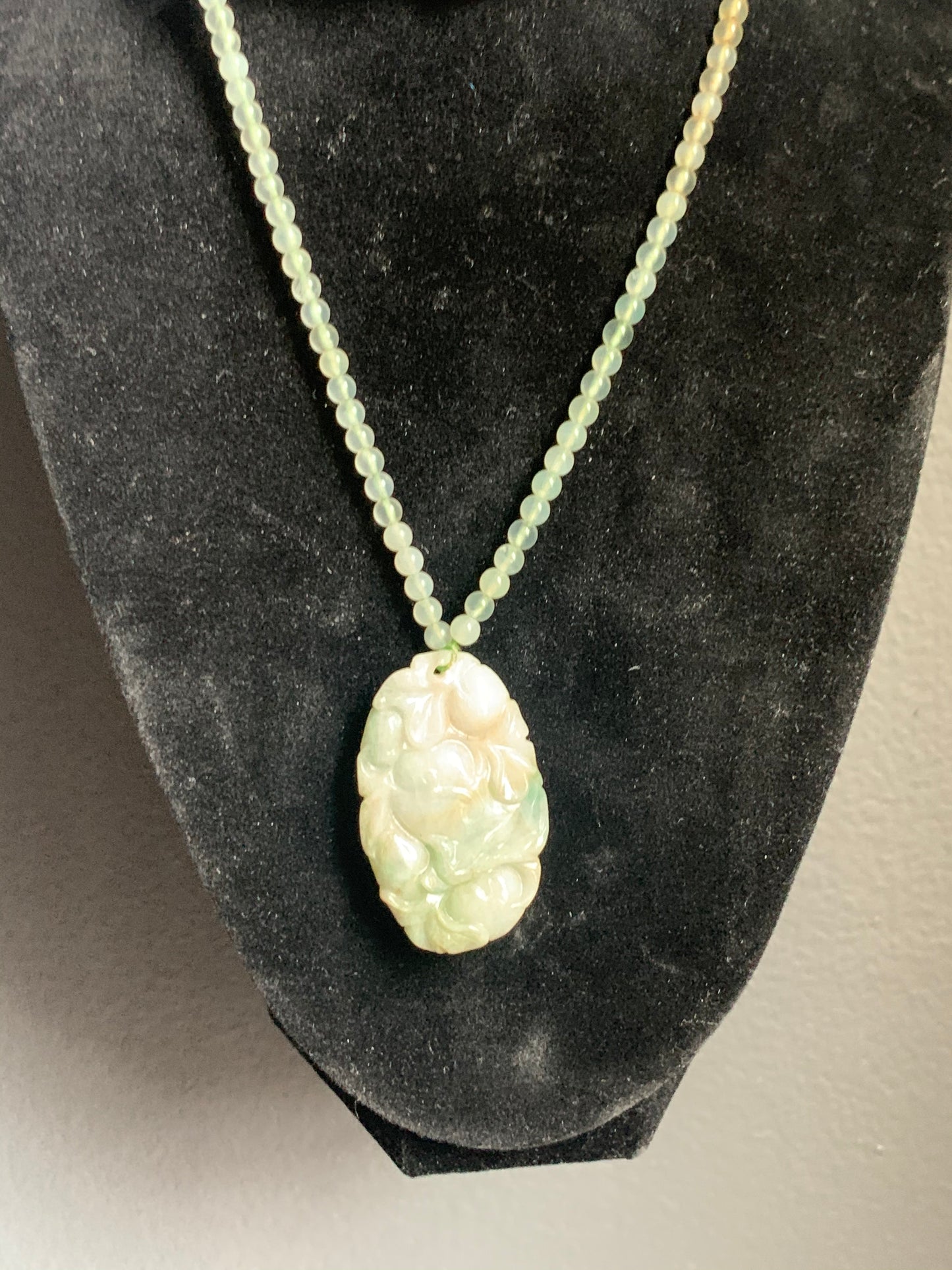 A jade necklace and pendant