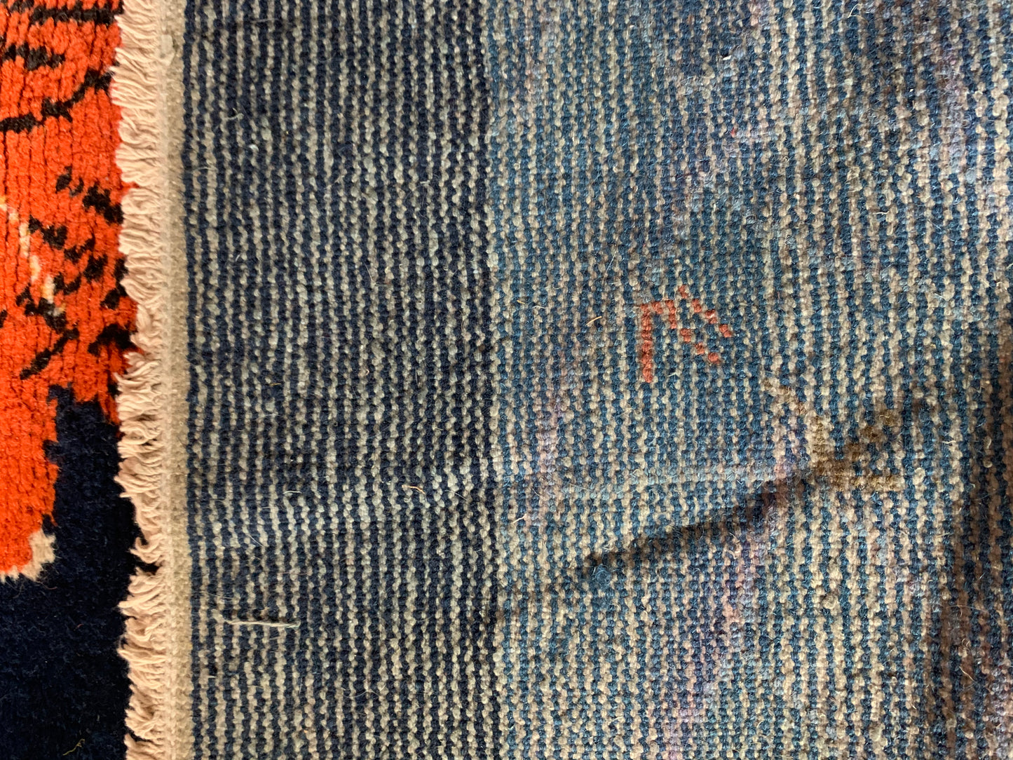 A vintage Tibetan Tiger carpet