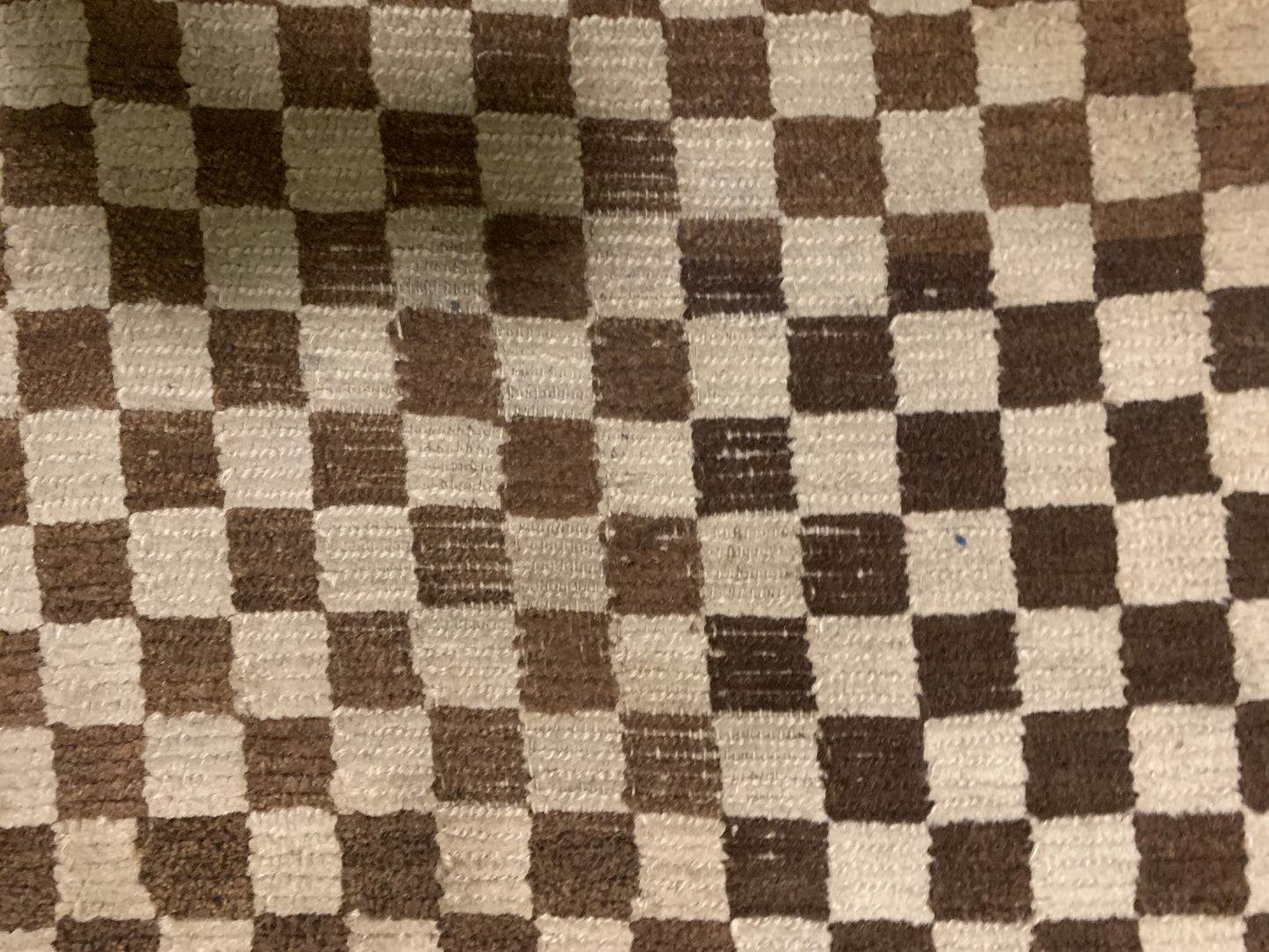 An antique Tibetan checkerboard rug