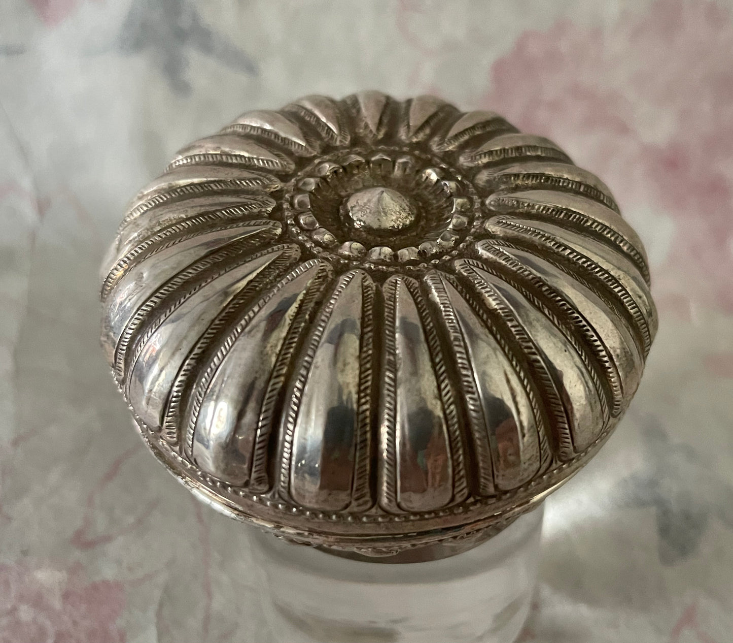An antique silver south East Asian round box with lid