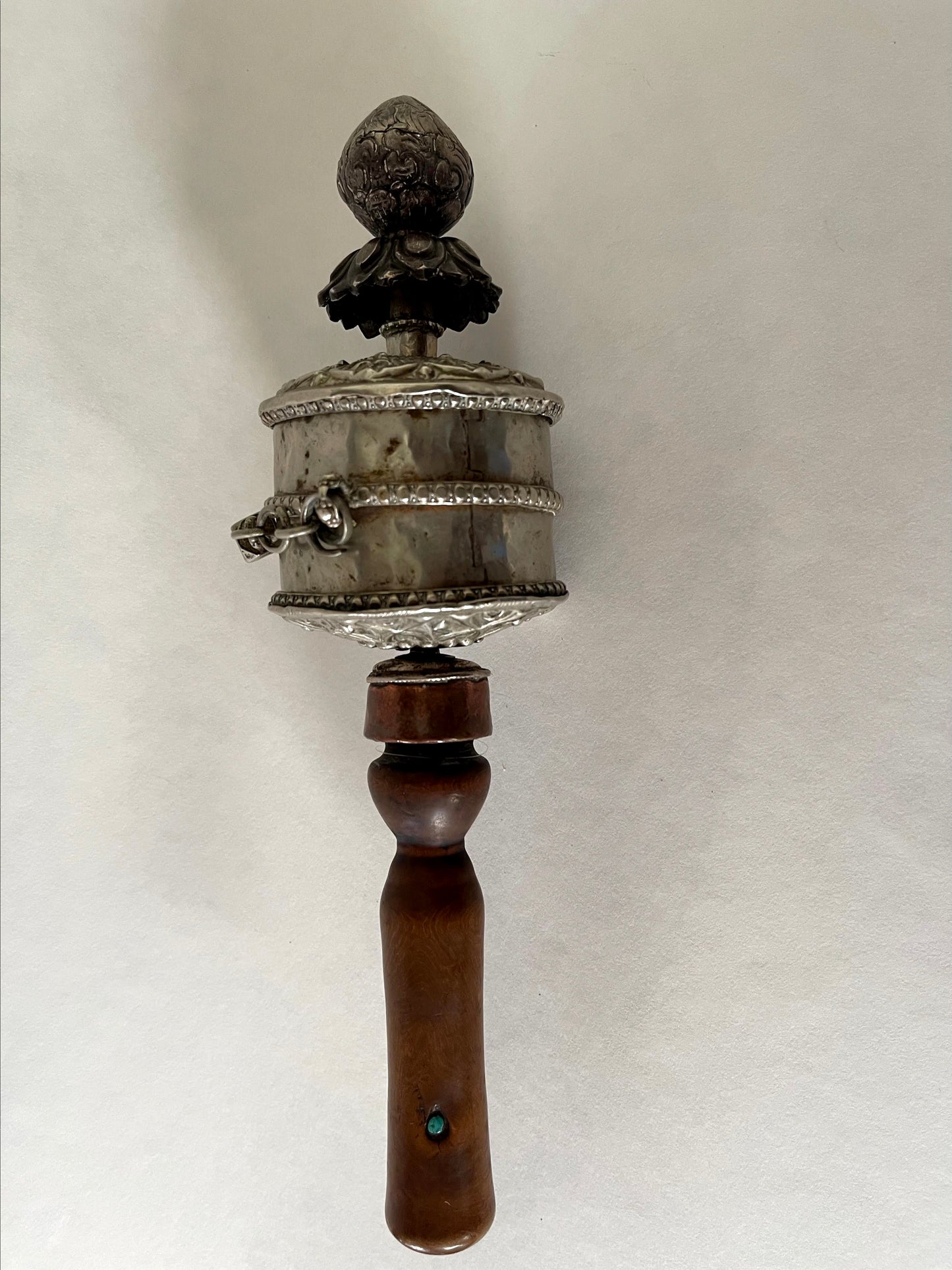 An original handmade vintage Tibetan silver handheld prayer wheel simply carved and decorated