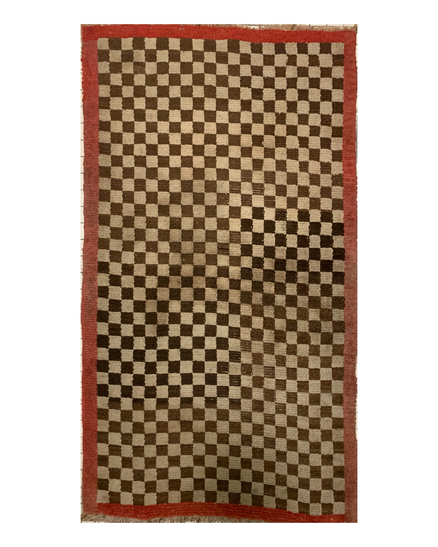 An antique Tibetan checkerboard rug