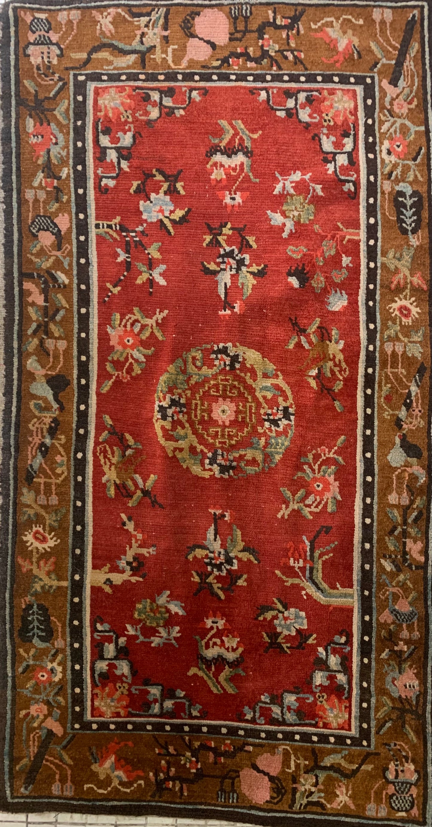 An antique Tibetan wool rug