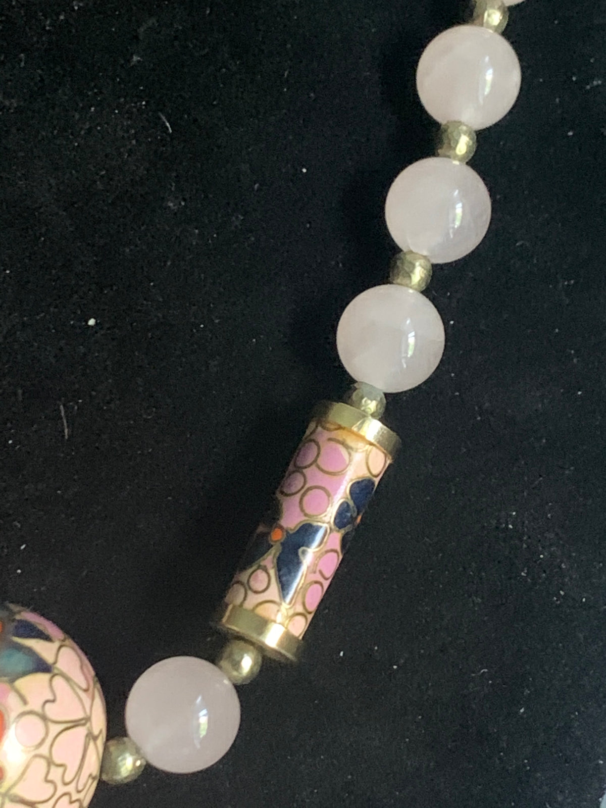 A necklace with rose quartz beads