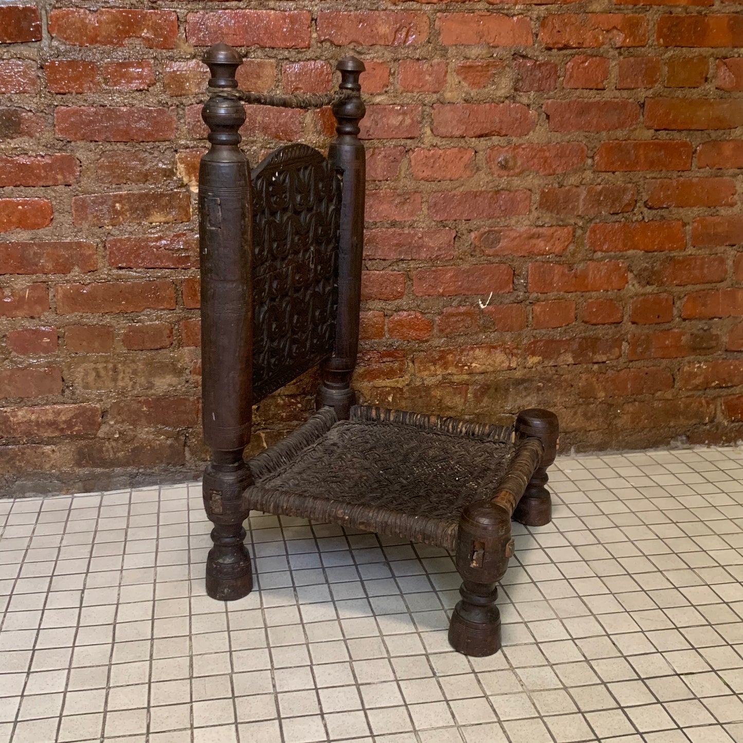 Low antique Indian chair