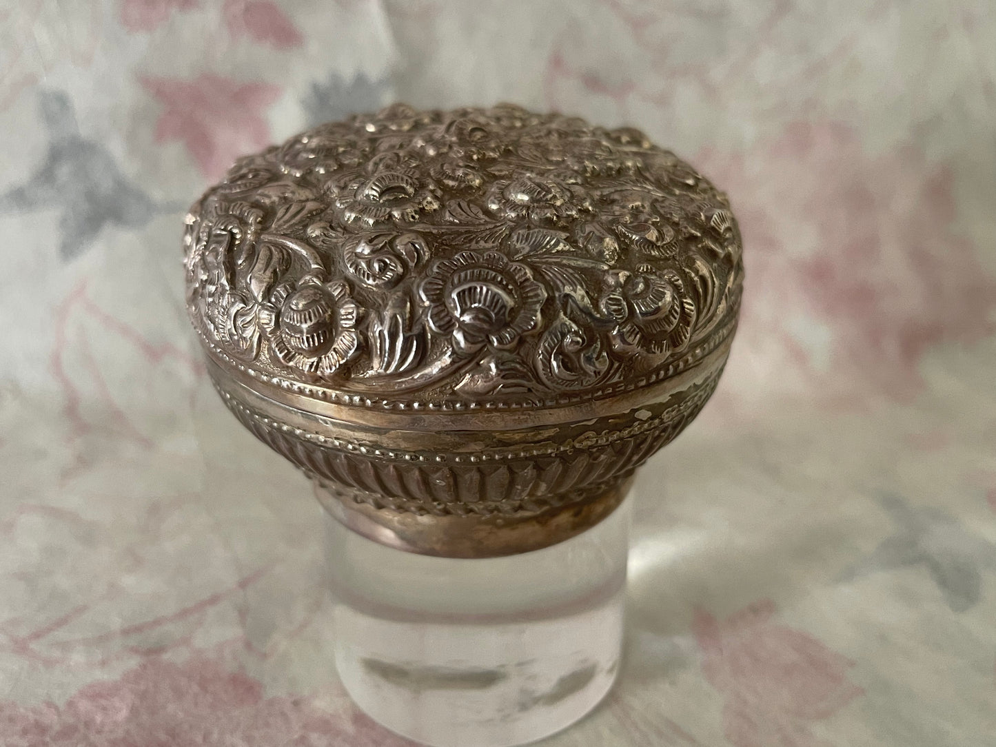 An antique silver south East Asian round box with lid