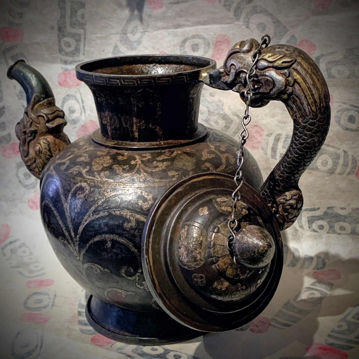 An antique Tibetan iron and silver teapot
