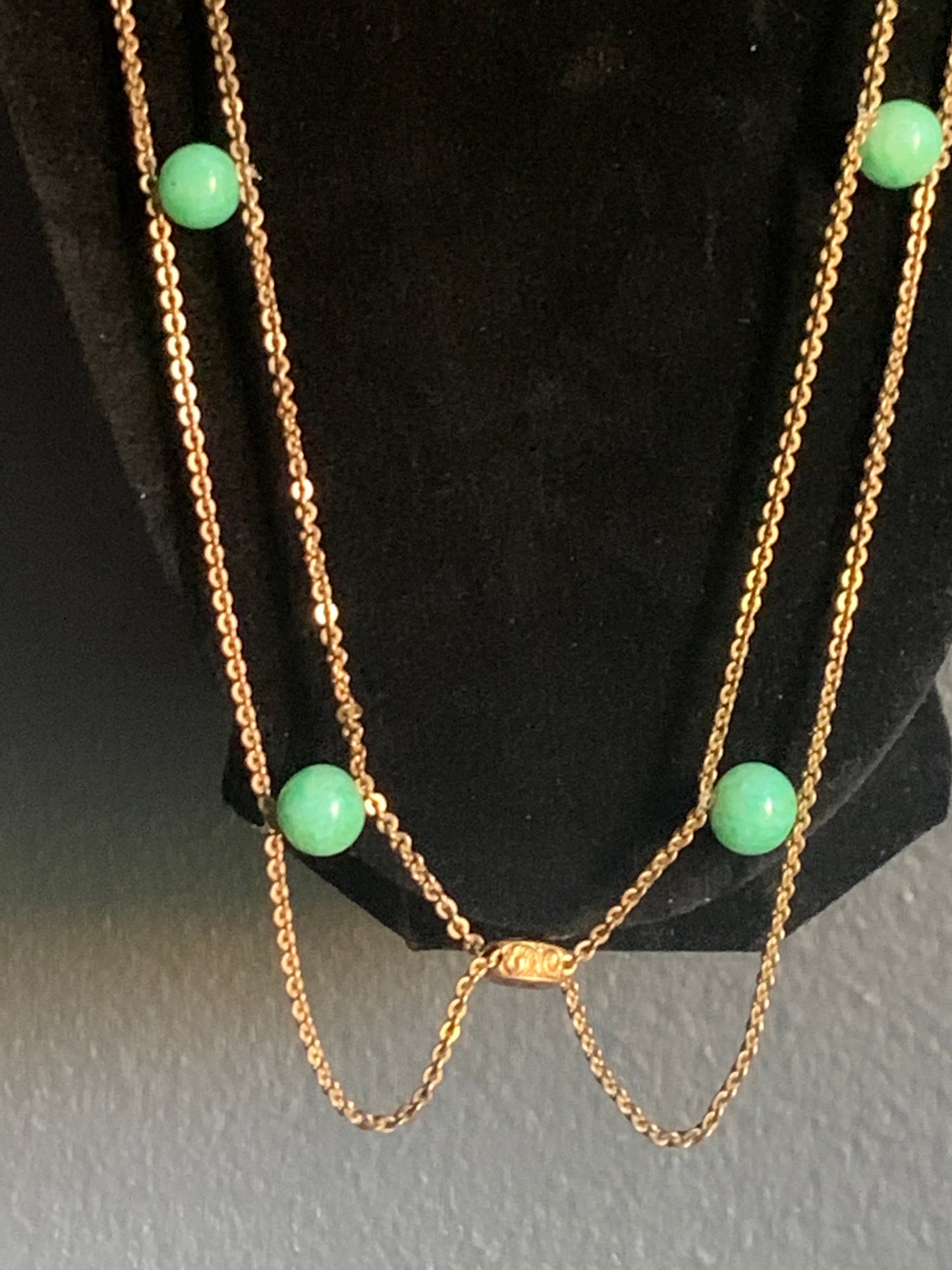 A jade and gold necklace