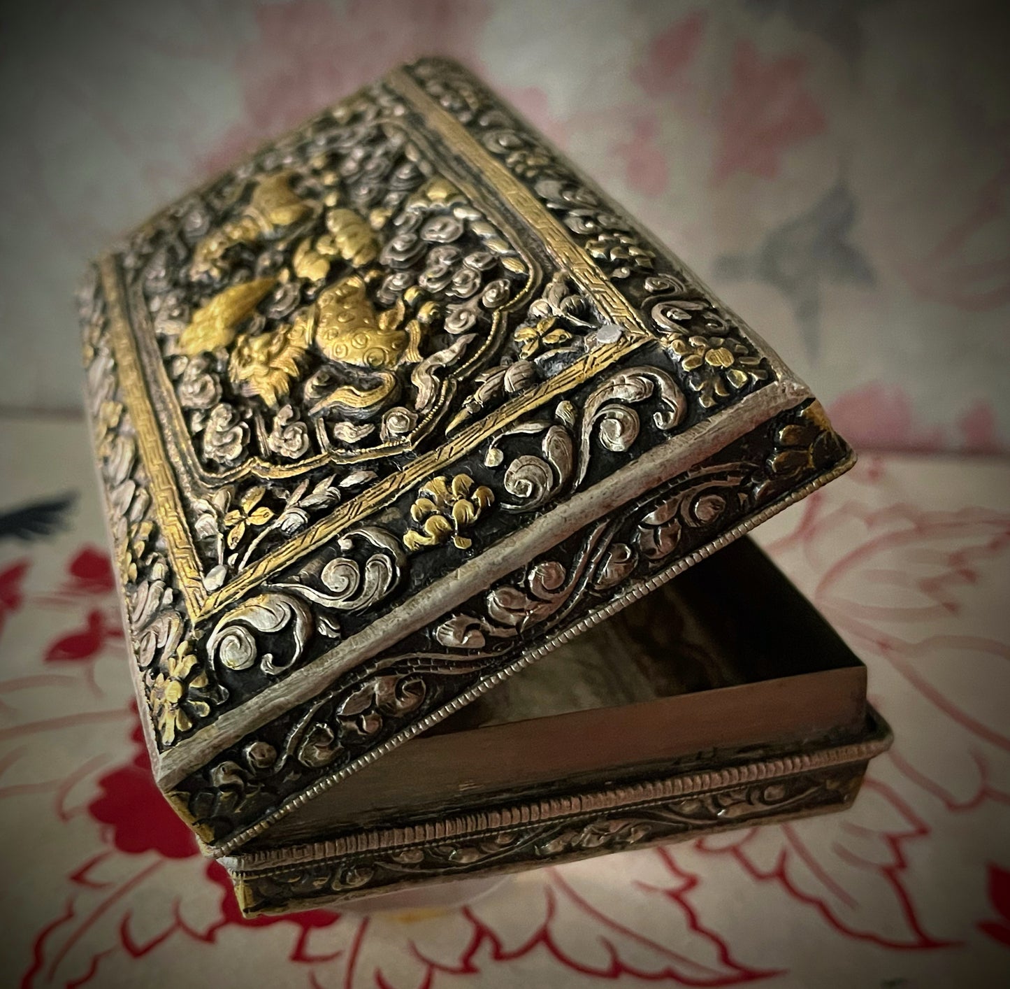 An antique carved Silver and gilded silver Bhutanese betel nut box
