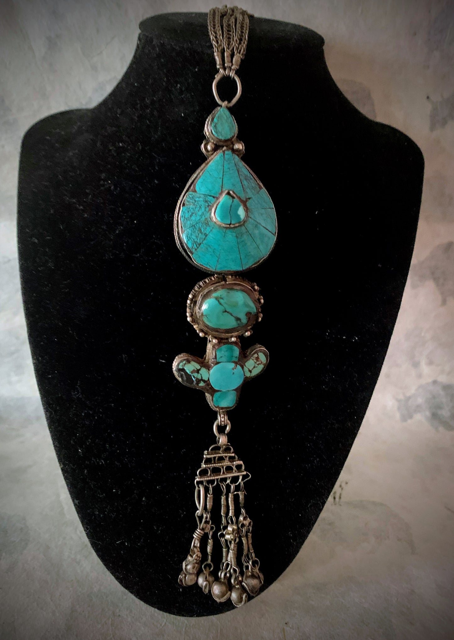 An antique turquoise and silver Tibetan ear pendant / earring