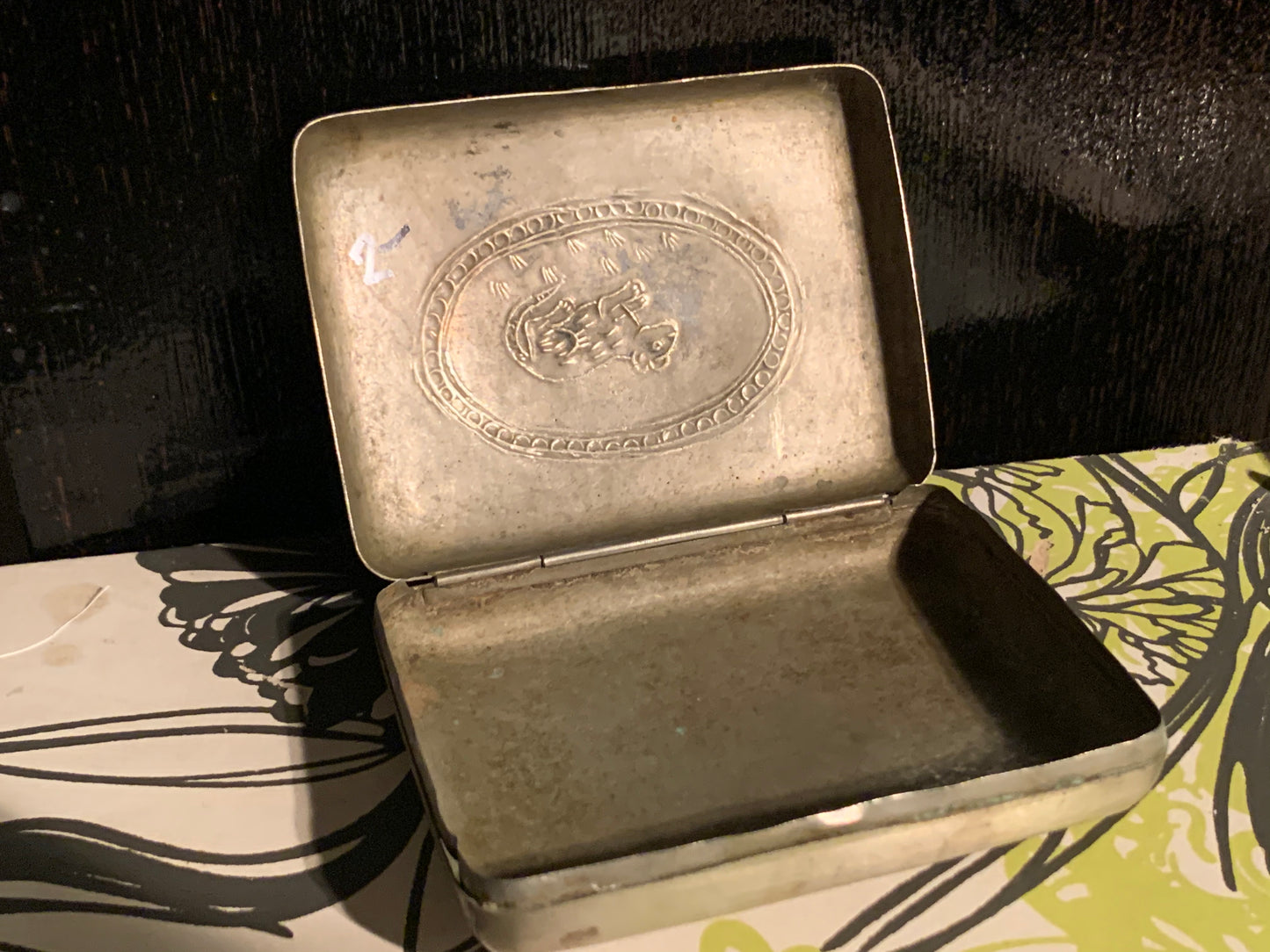 A silver box with hinged lid