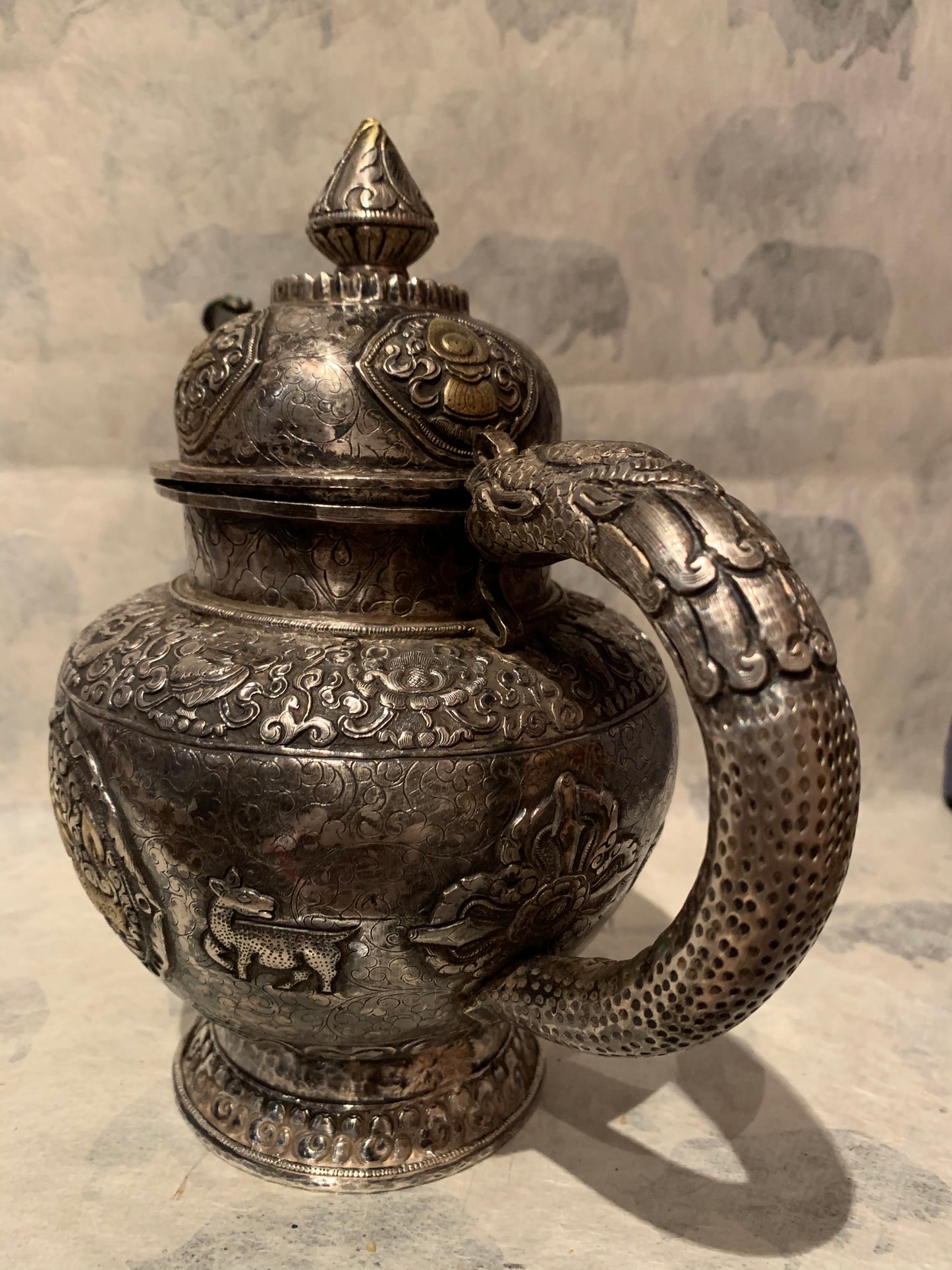 An antique silver and gilt ceremonial Tibetan teapot