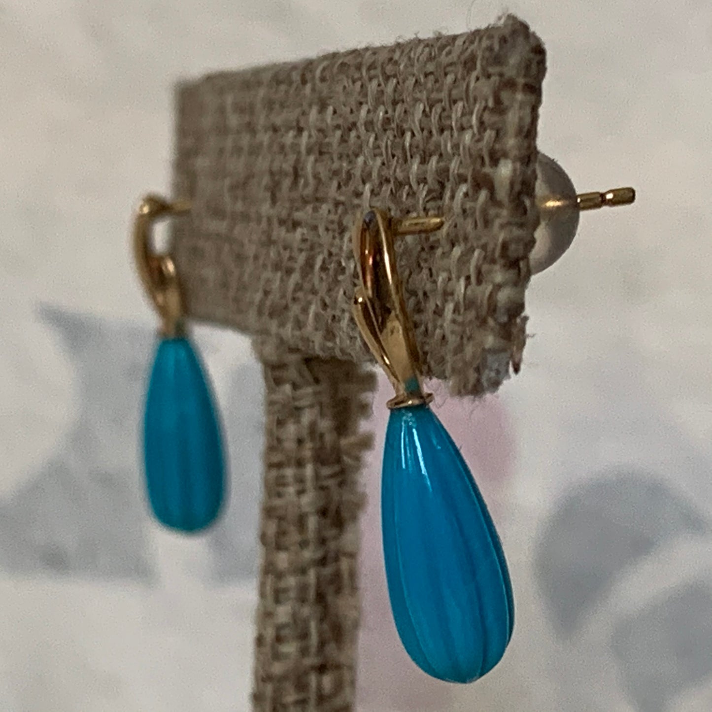 A pair of turquoise earrings