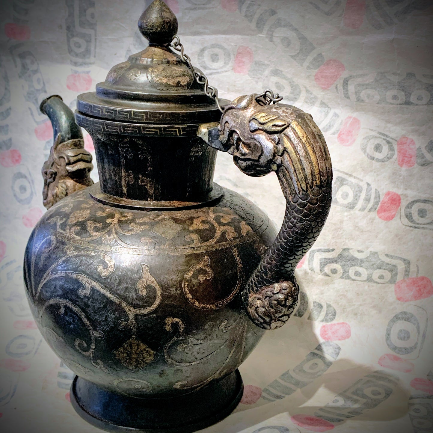 An antique Tibetan iron and silver teapot