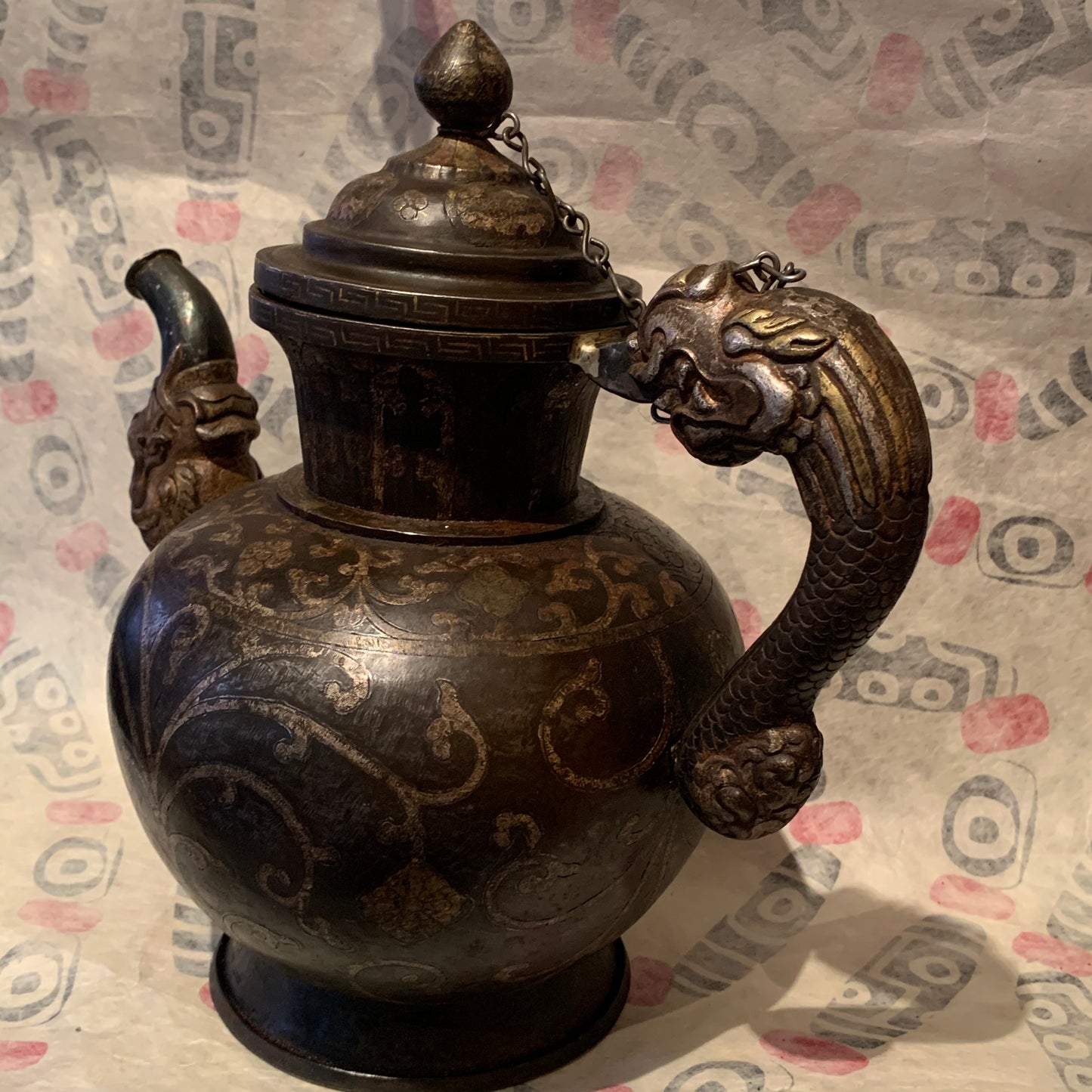An antique Tibetan iron and silver teapot
