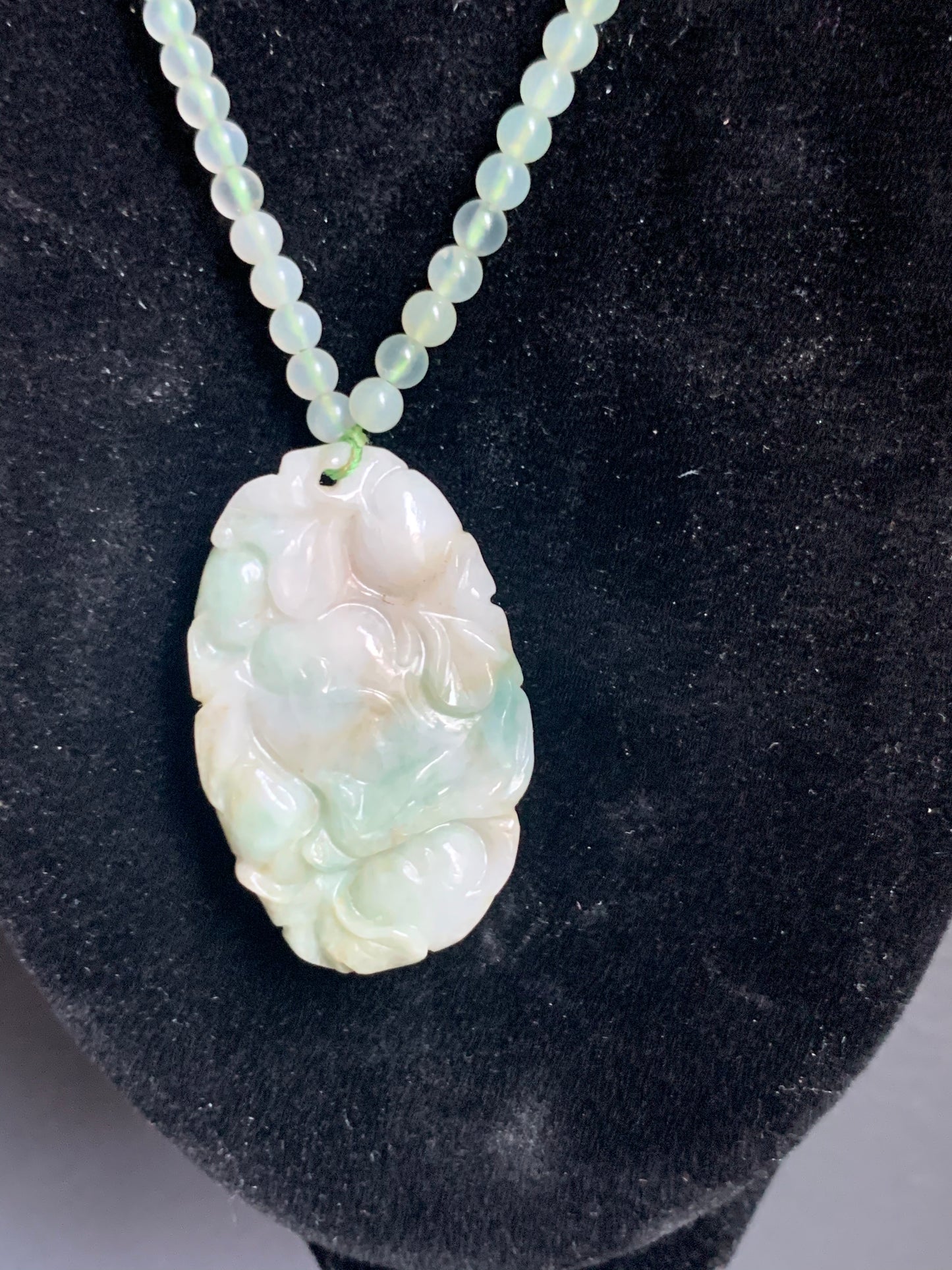 A jade necklace and pendant