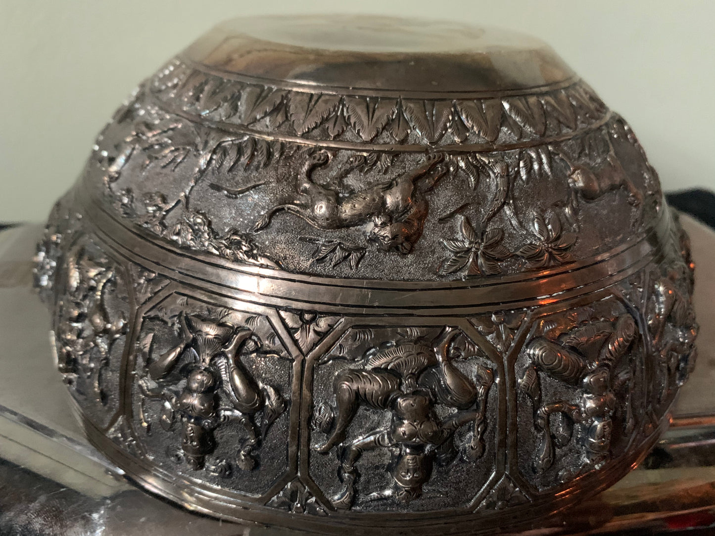 A silver repousse bowl