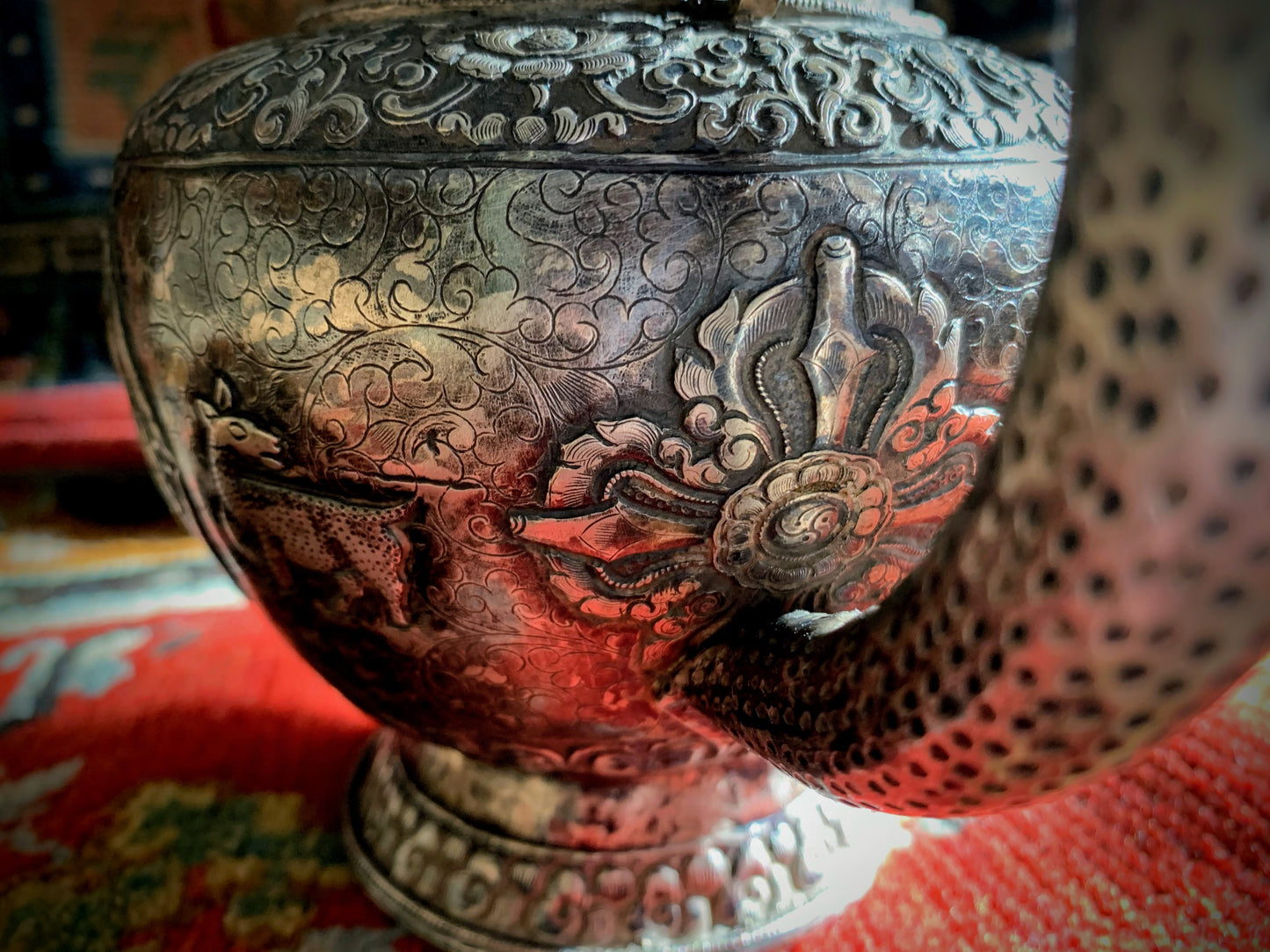 An antique silver and gilt ceremonial Tibetan teapot
