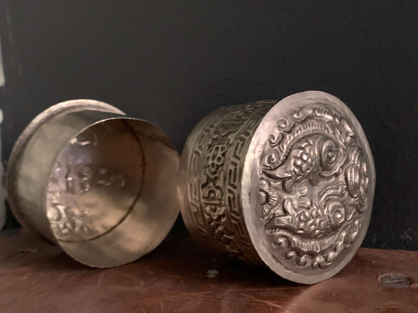 A cylindrical silver box