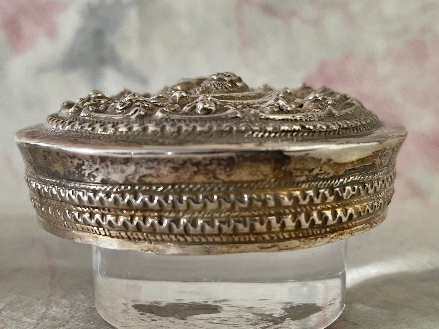 An antique silver south East Asian round box with lid