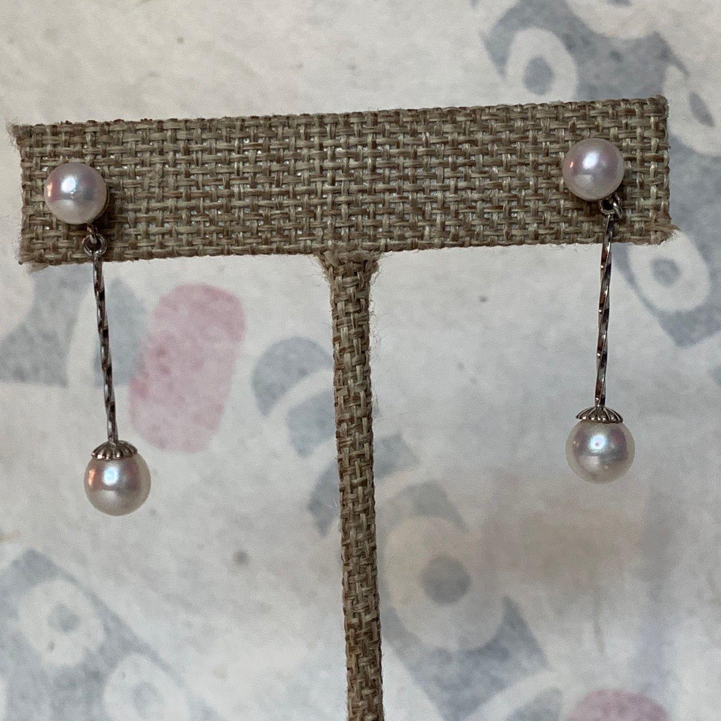 A pair of pearl dangling earrings