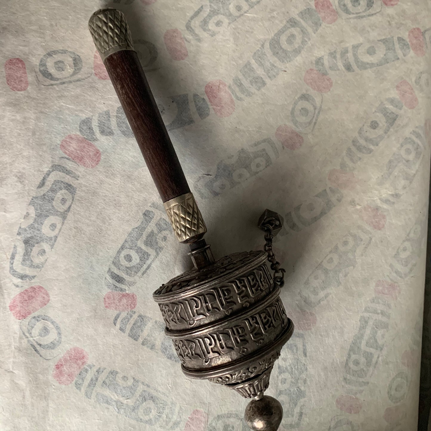 An antique Tibetan handheld prayer wheel