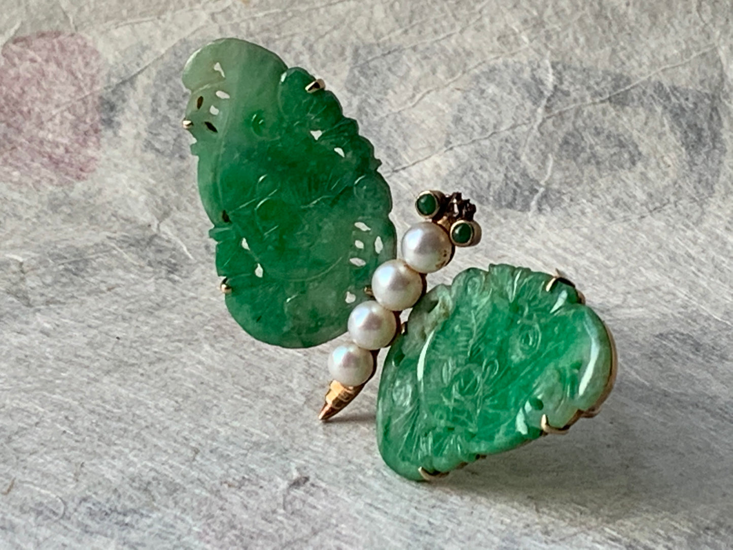 A vintage jade butterfly brooch