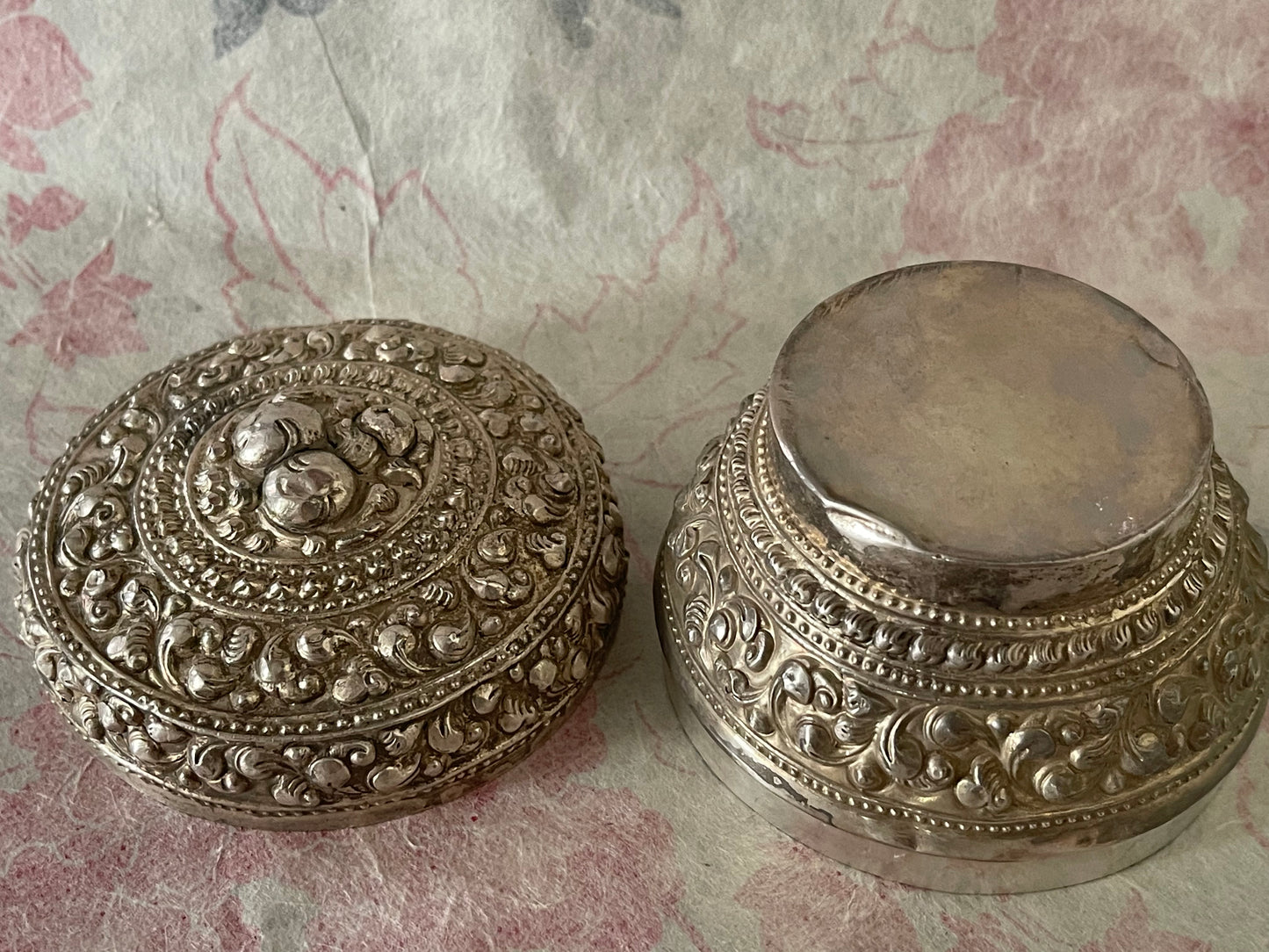 An antique silver south East Asian round box with lid
