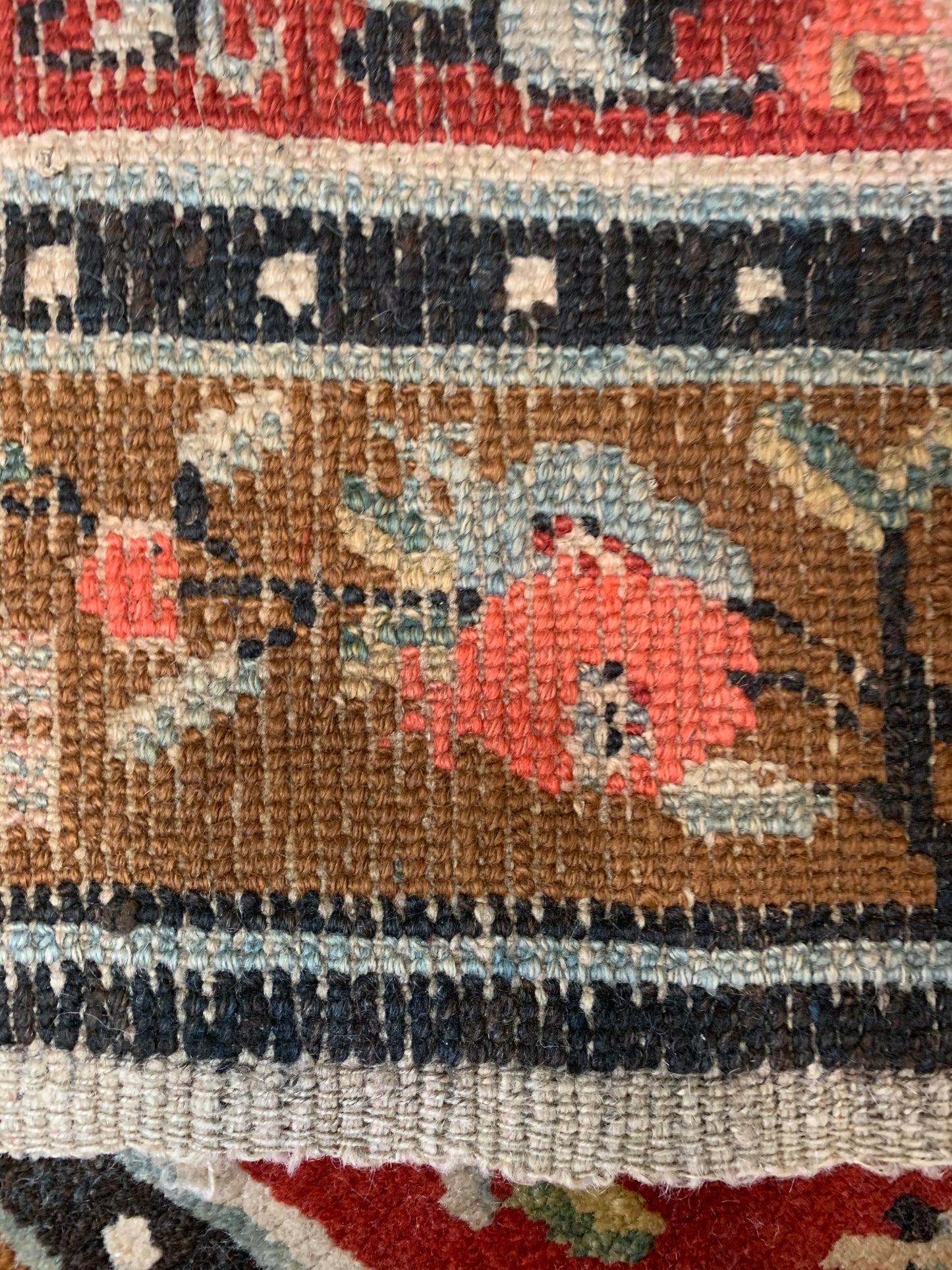 An antique Tibetan wool rug
