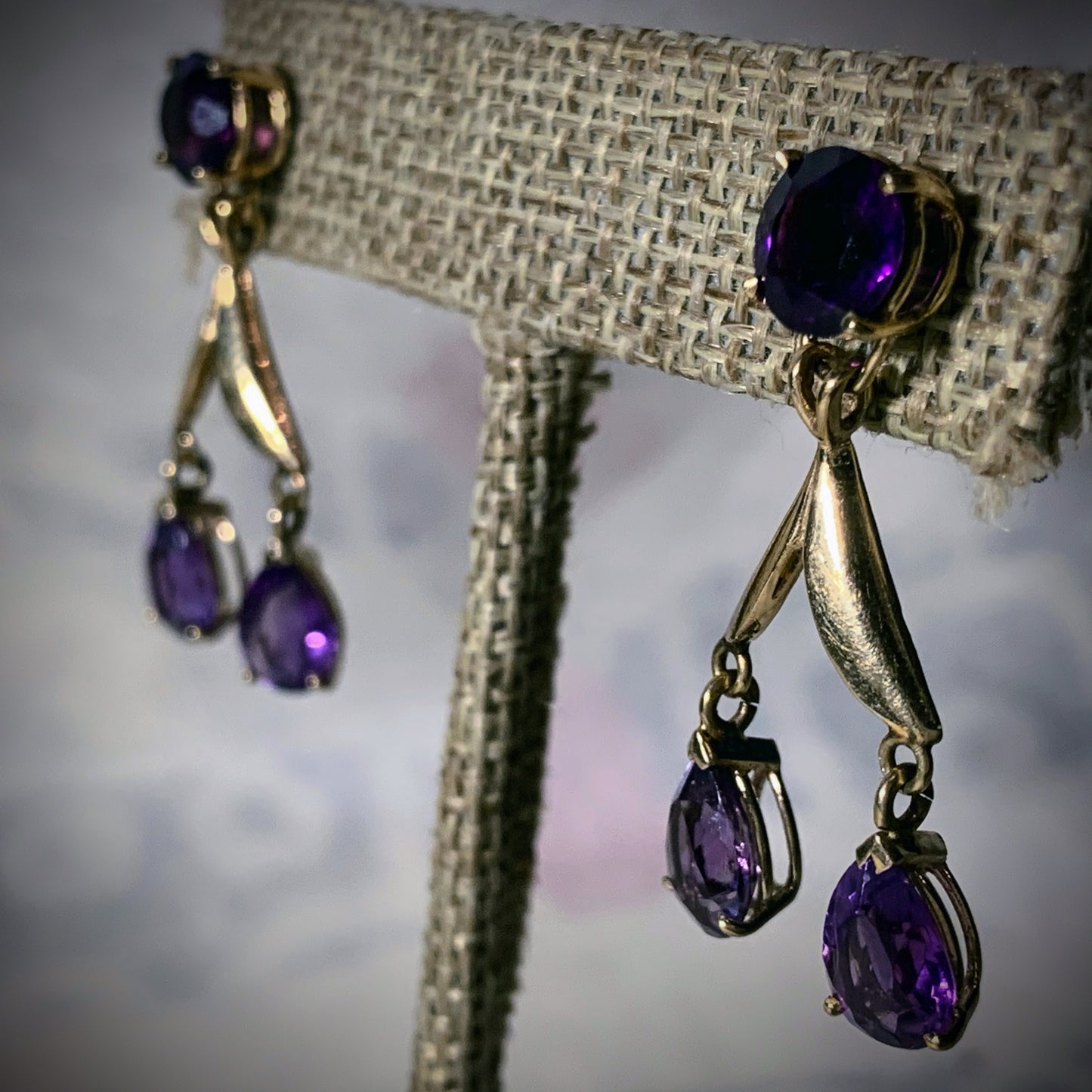 A pair of amethyst gold earrings