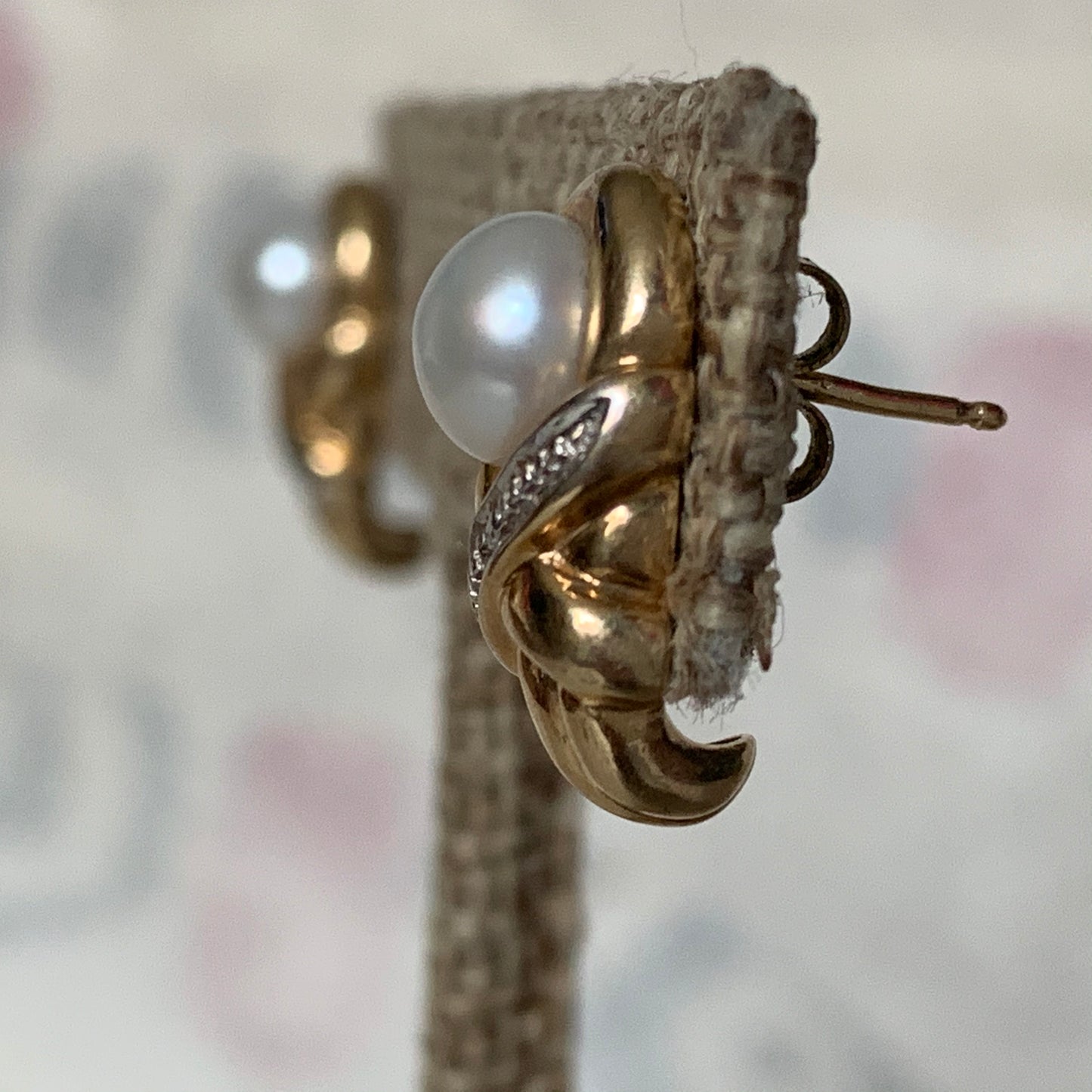 A pair of vintage pearl earrings