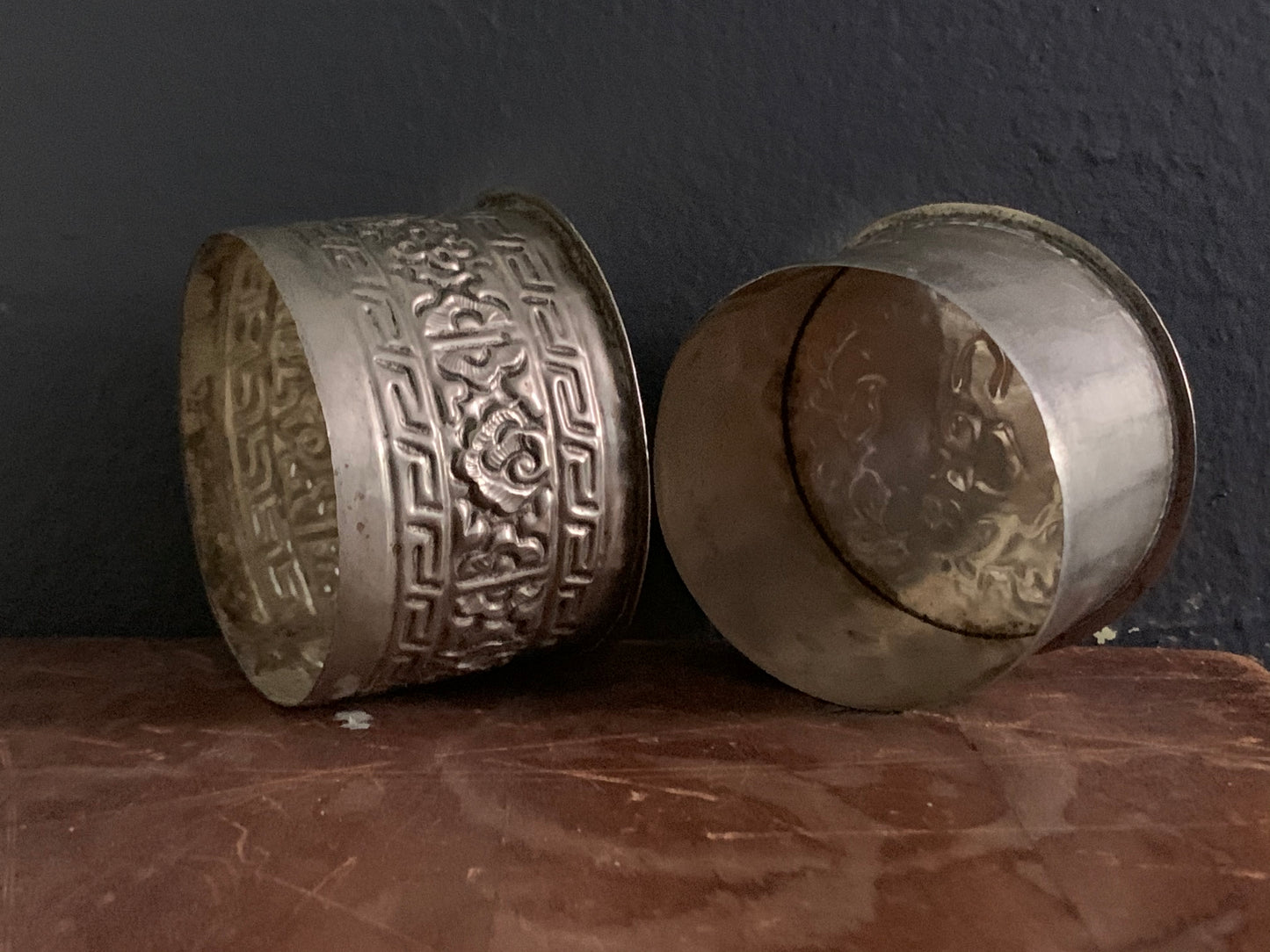 A cylindrical silver box