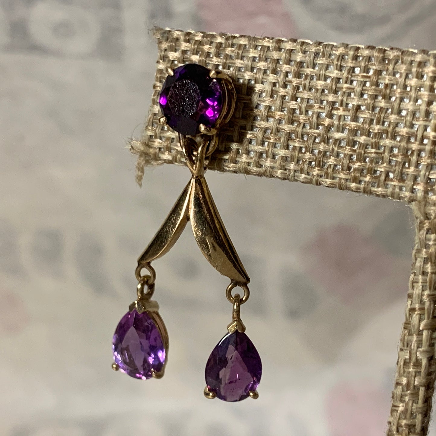 A pair of amethyst gold earrings