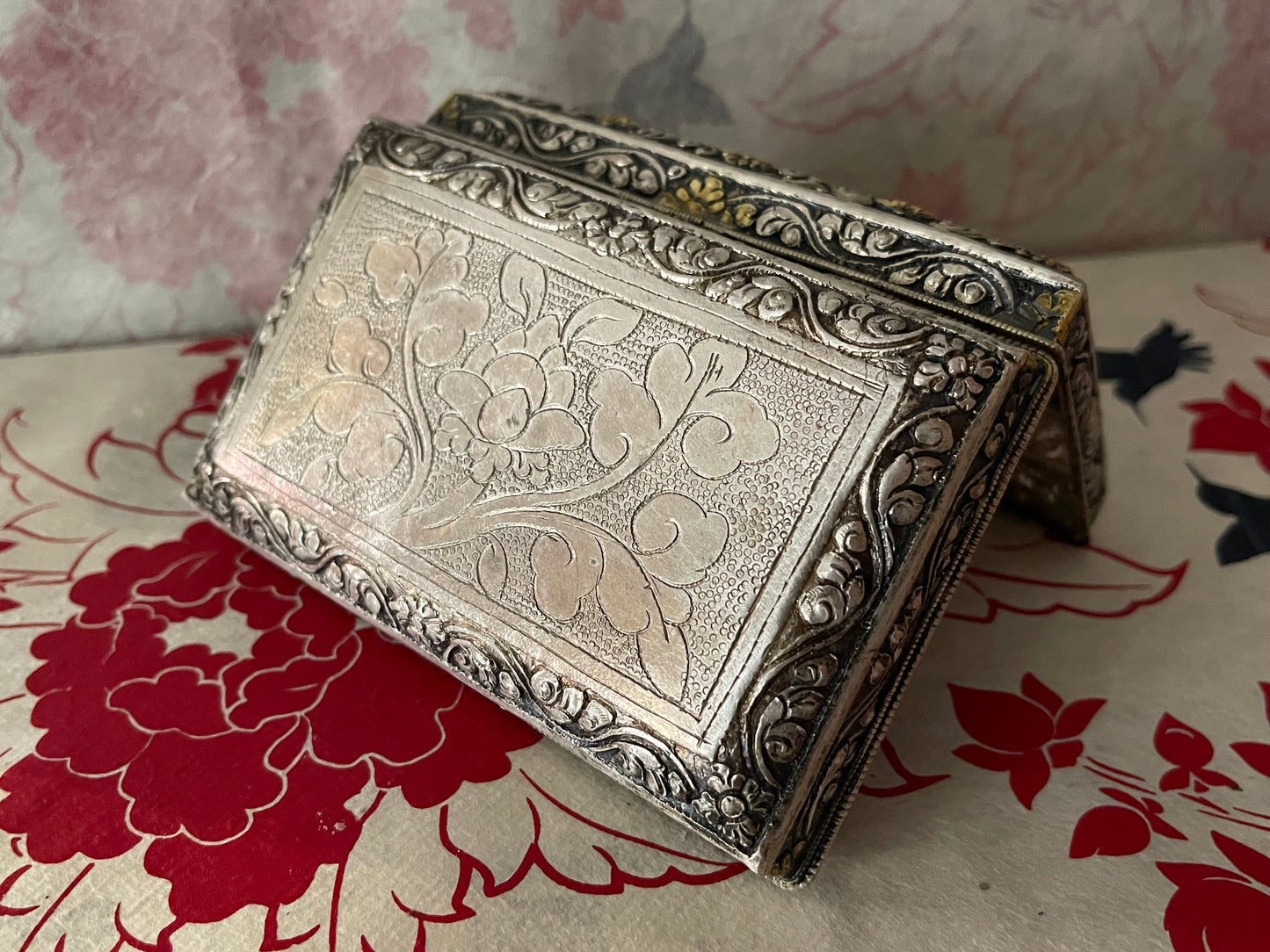 An antique carved Silver and gilded silver Bhutanese betel nut box