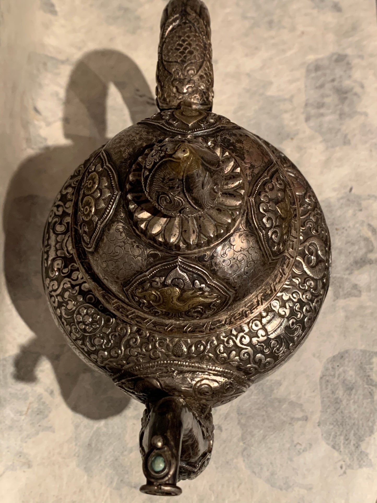 An antique silver and gilt ceremonial Tibetan teapot