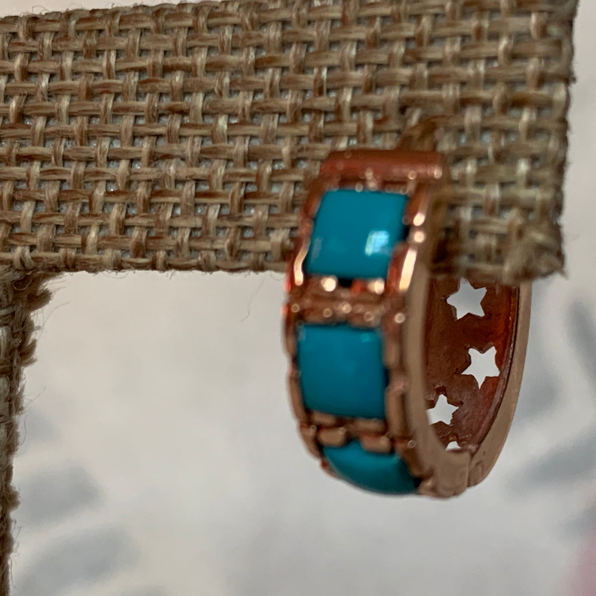 A pair of turquoise hoop earrings