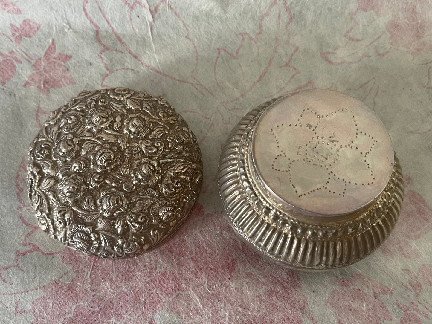 An antique silver south East Asian round box with lid