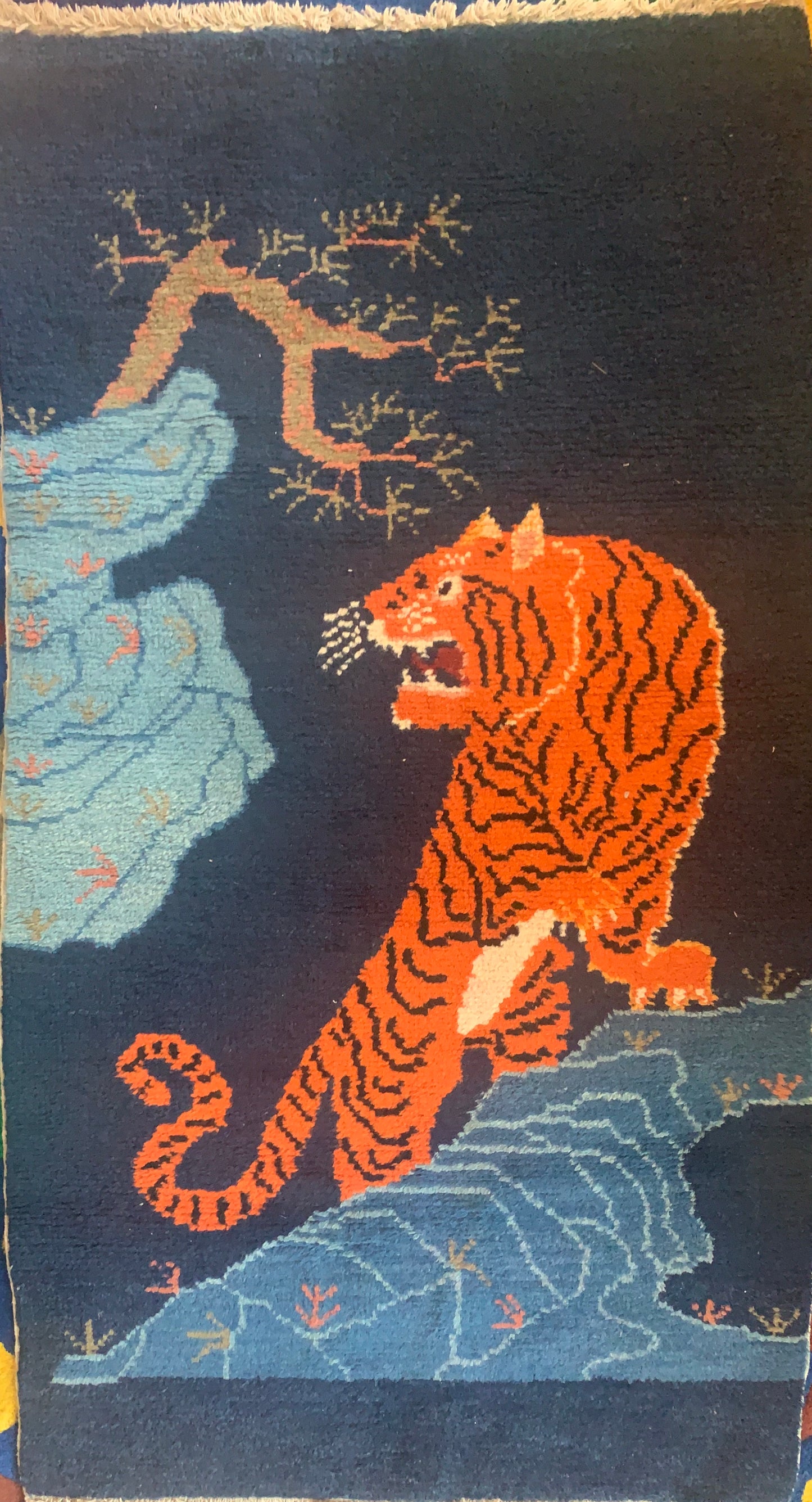 A vintage Tibetan Tiger carpet