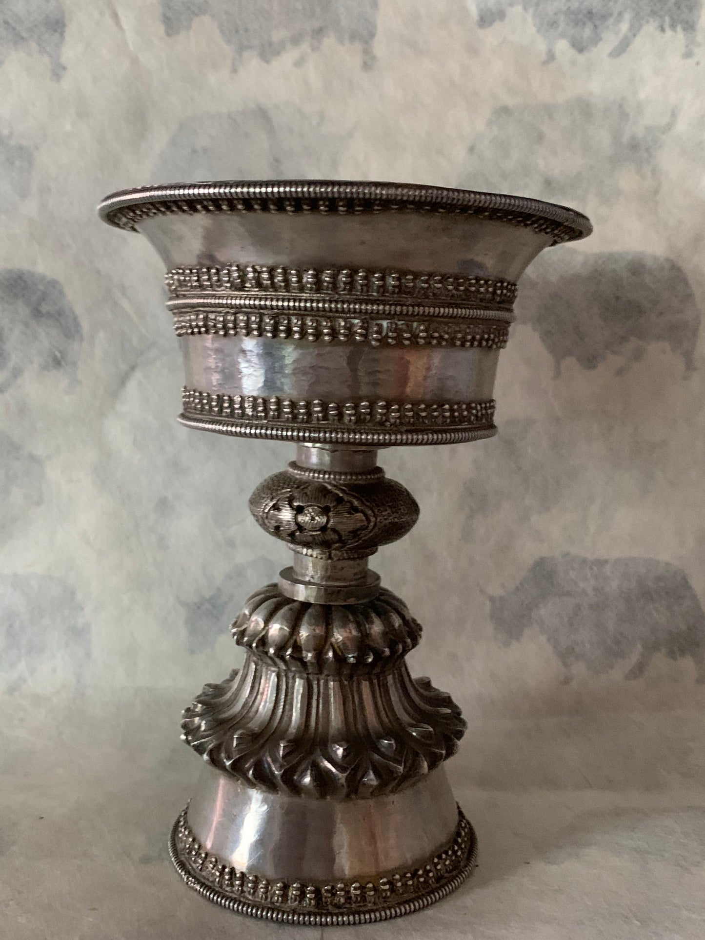An antique Tibetan silver butterlamp