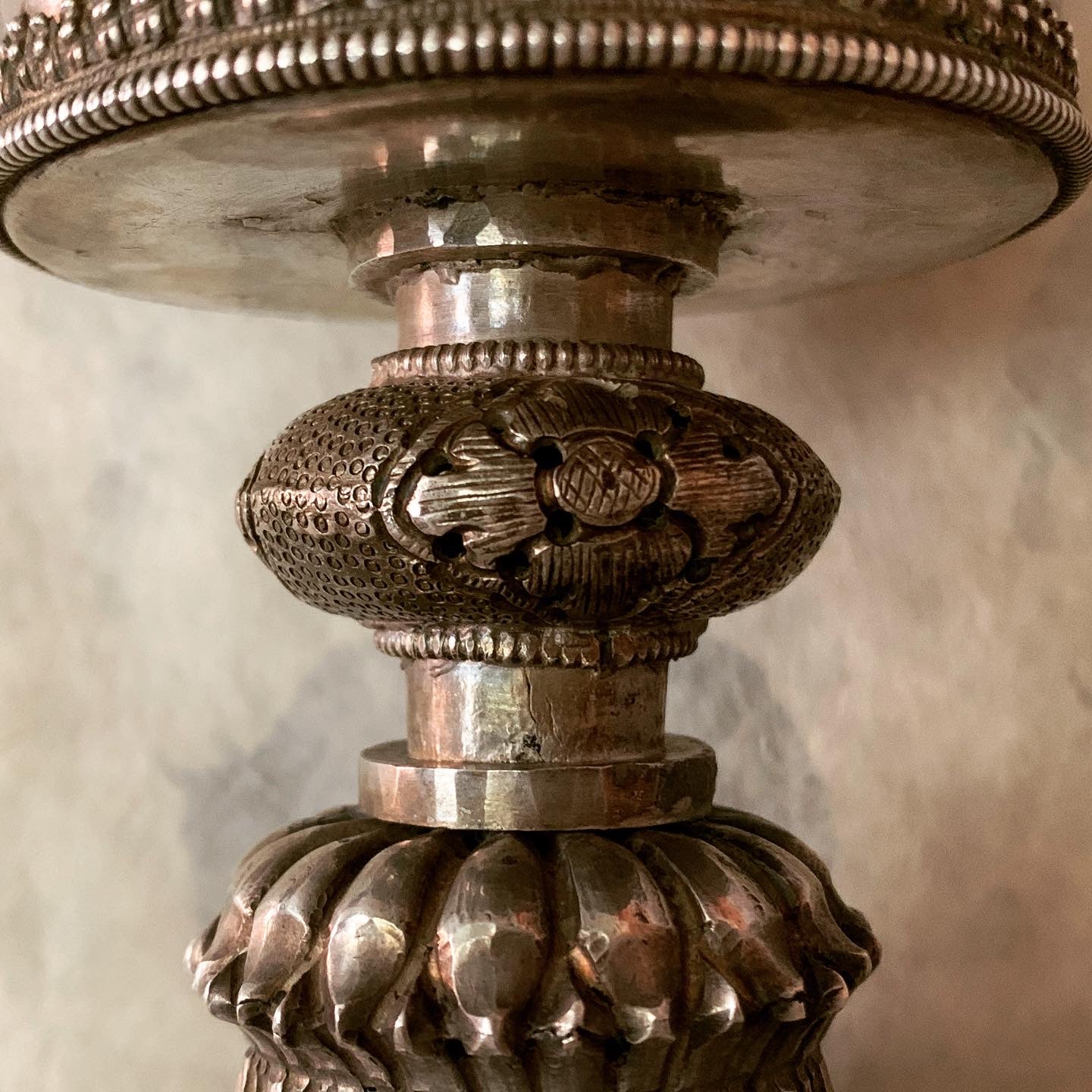 An antique Tibetan silver butterlamp