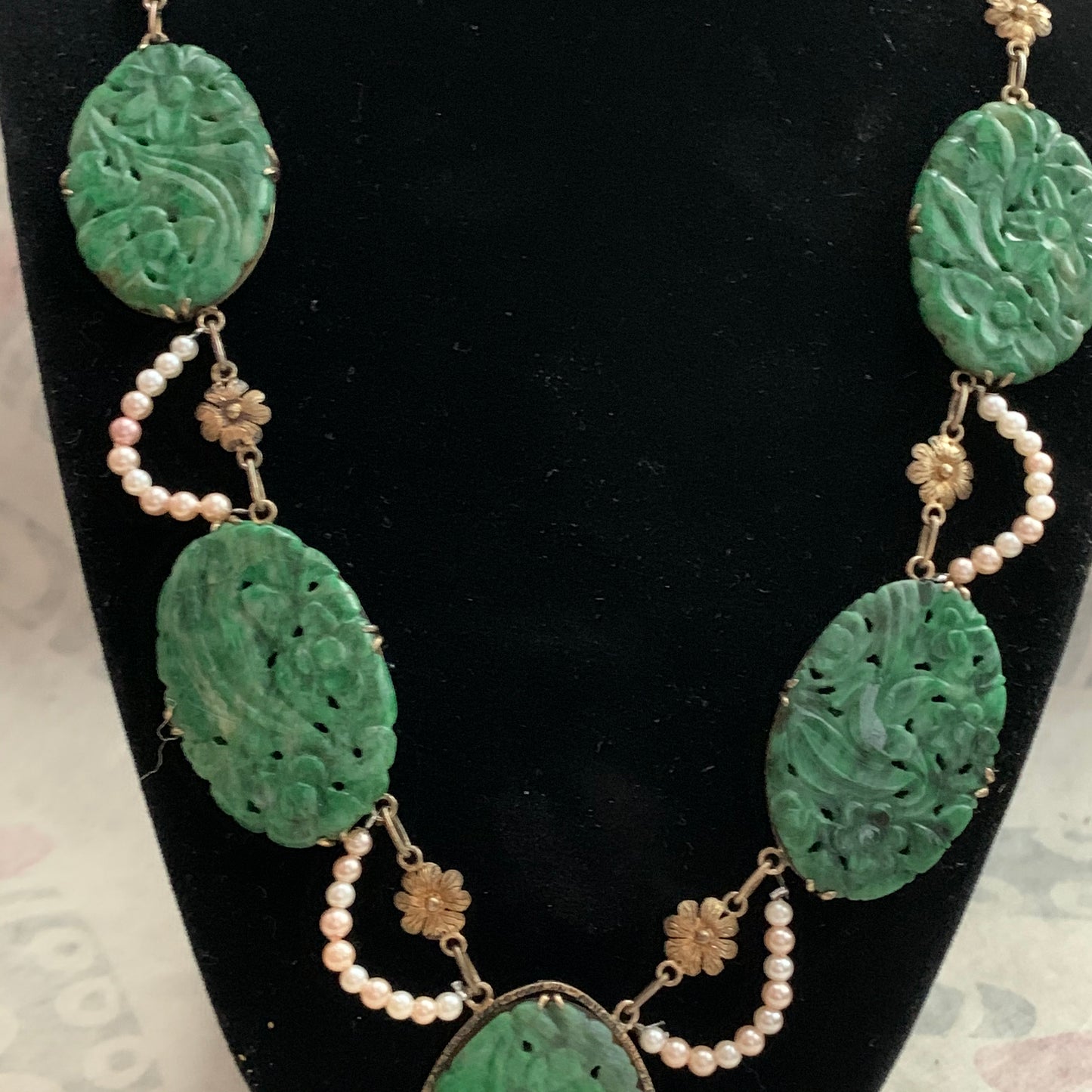A spinach green jade necklace