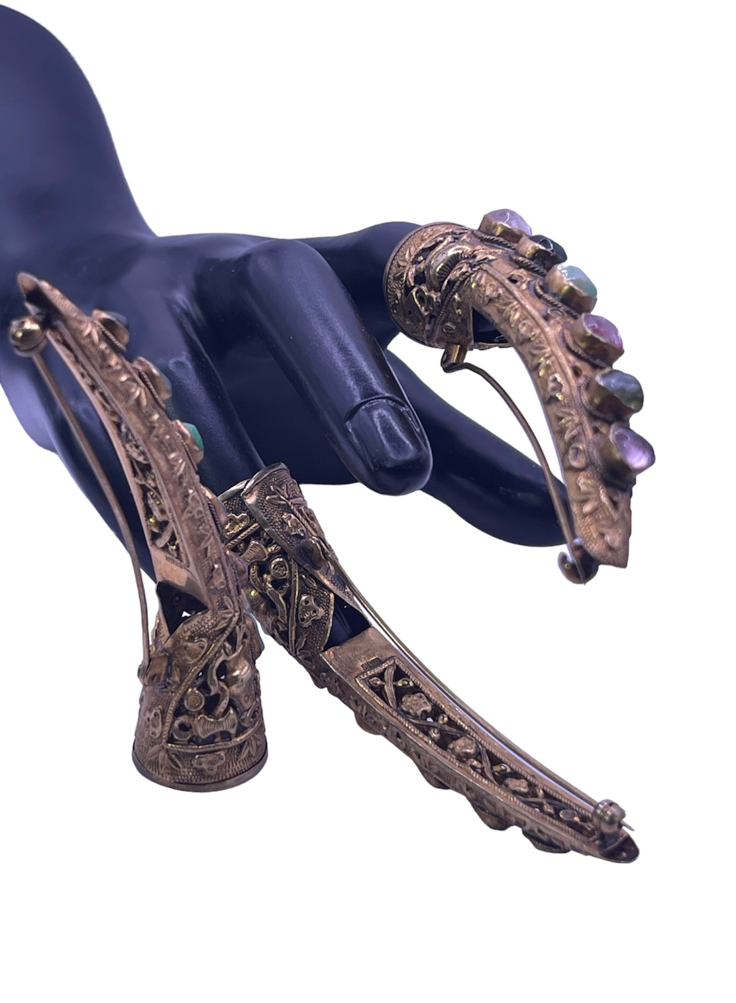 A set of three vintage gilded silver nail covers