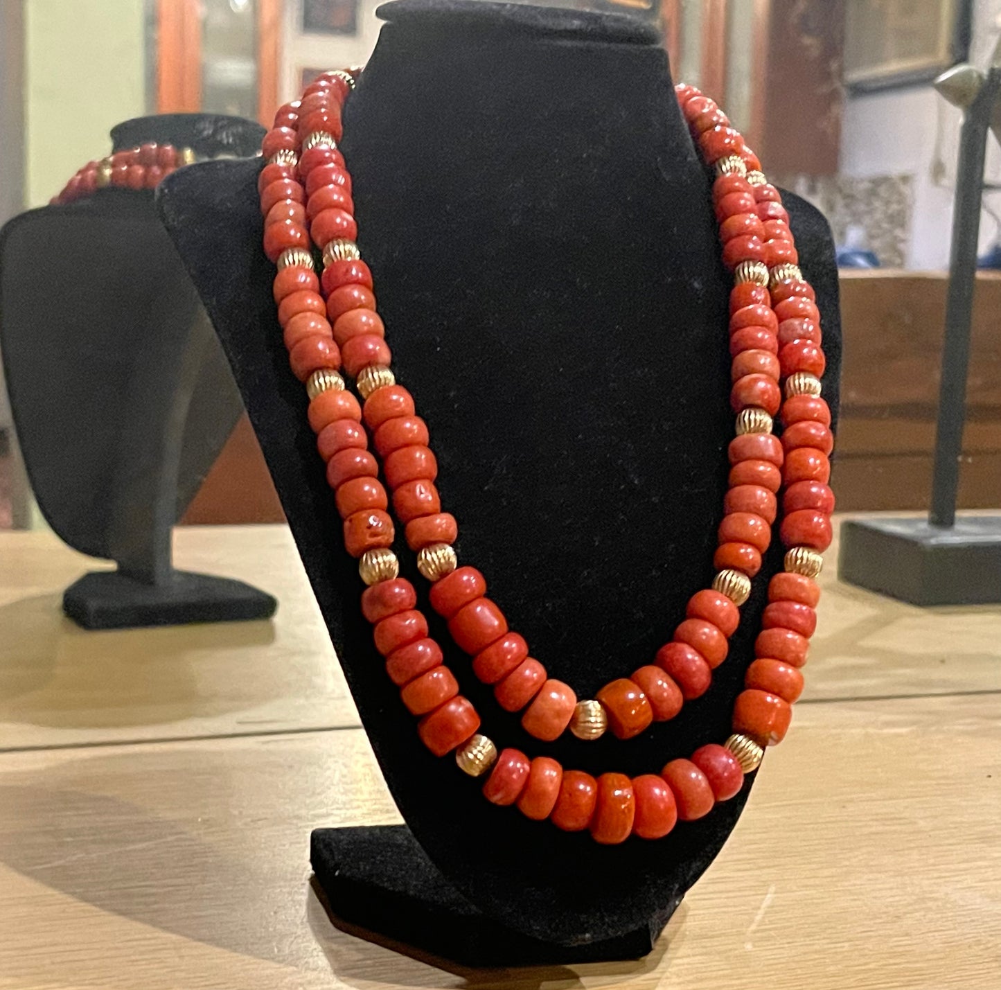 A coral and gold bead necklace