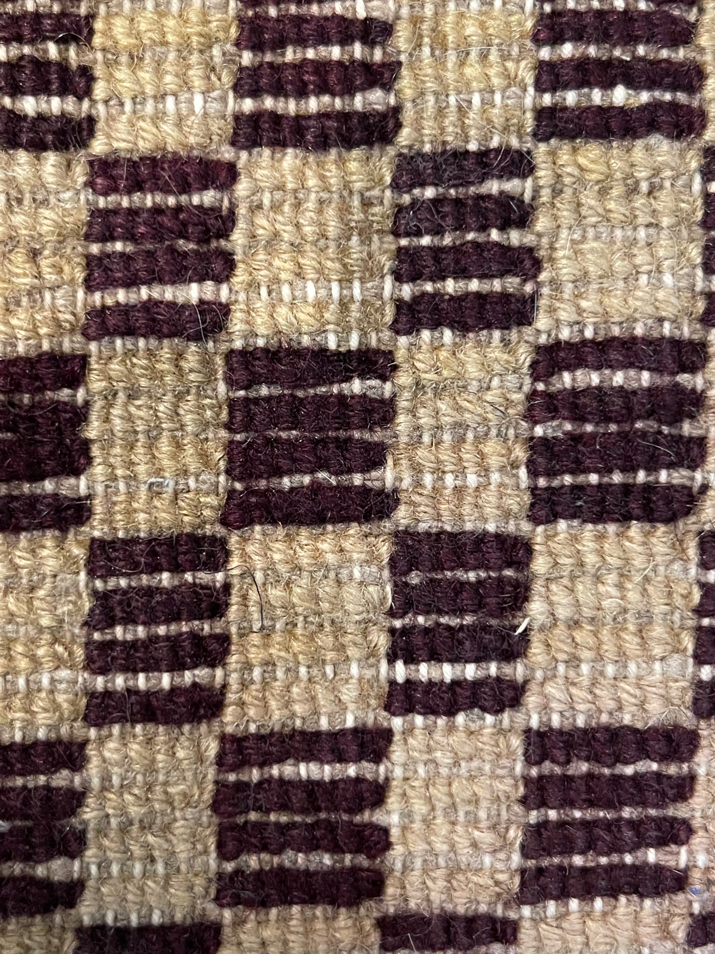 An antique Tibetan checkerboard handmade wool rug