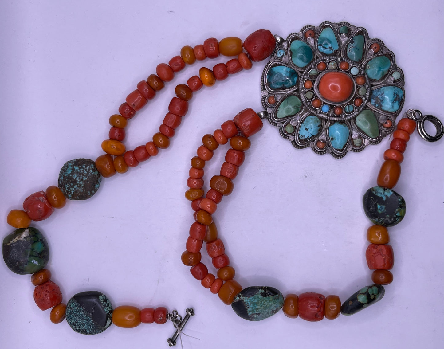 Coral, amber and turquoise necklace with a turquoise and coral silver pendant
