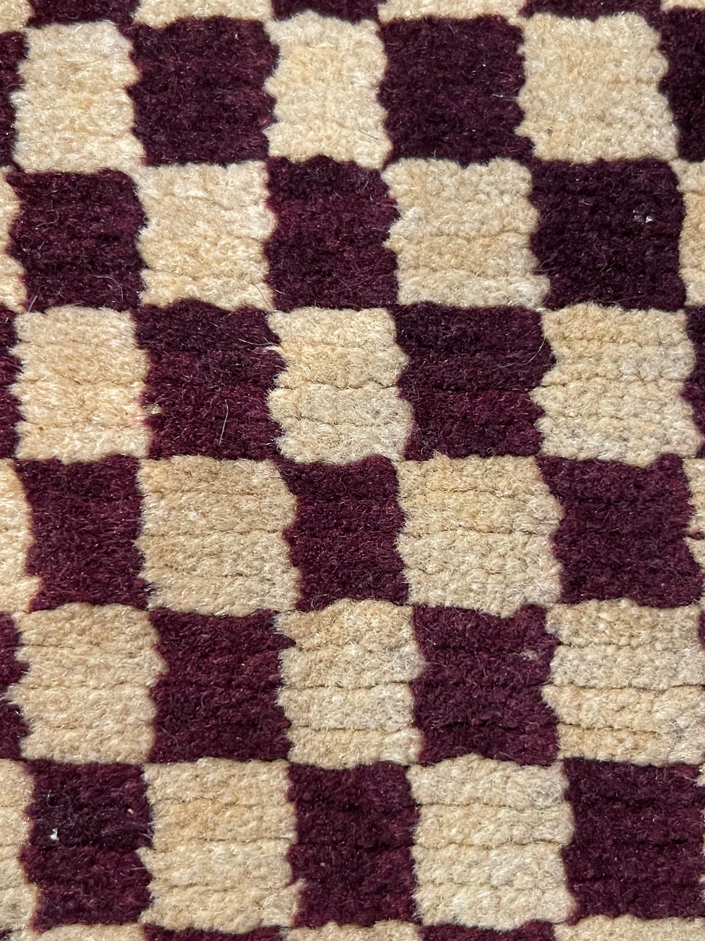 An antique Tibetan checkerboard handmade wool rug