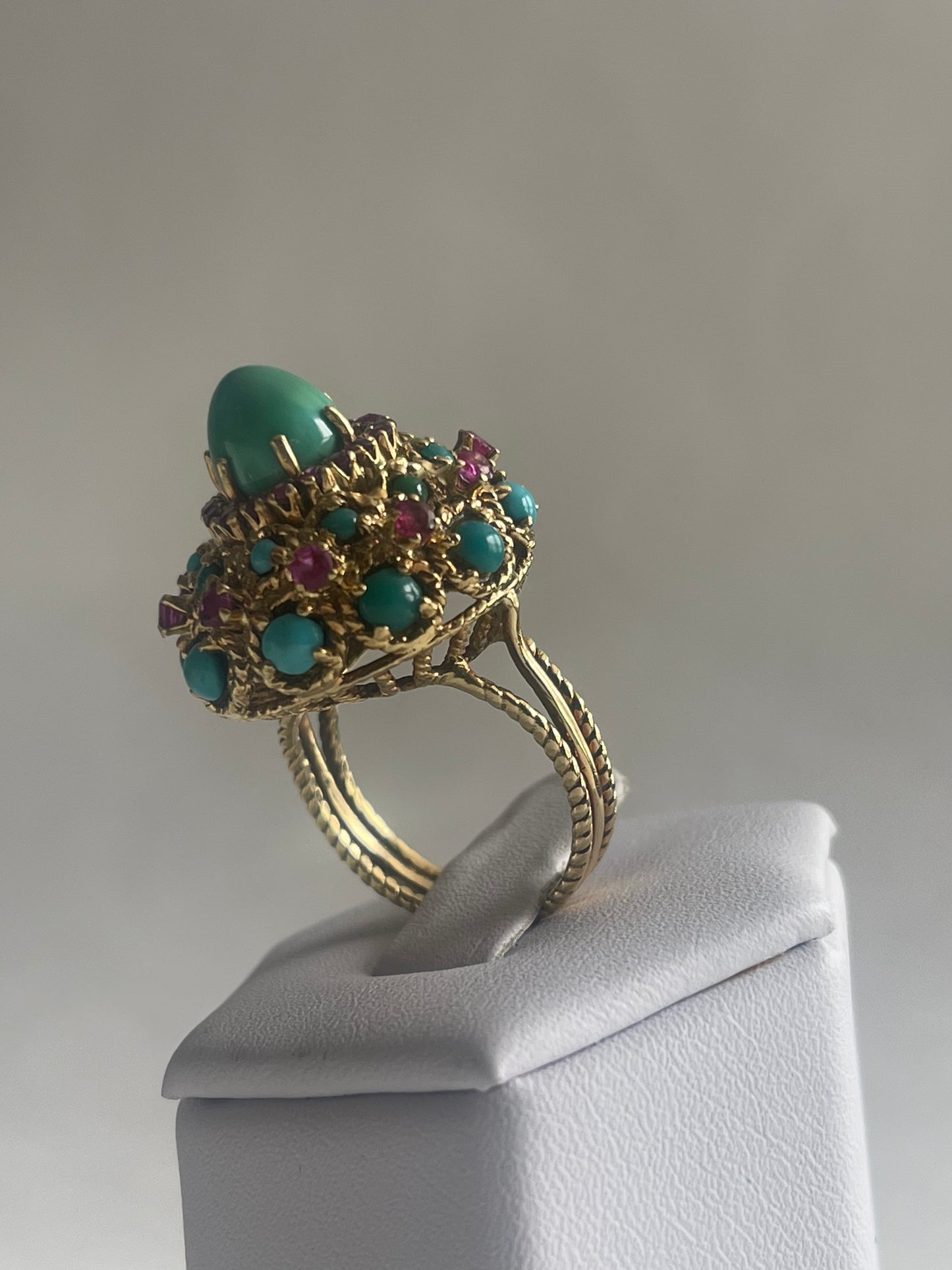 A vintage turquoise dome ring with rubies in a 14kt setting